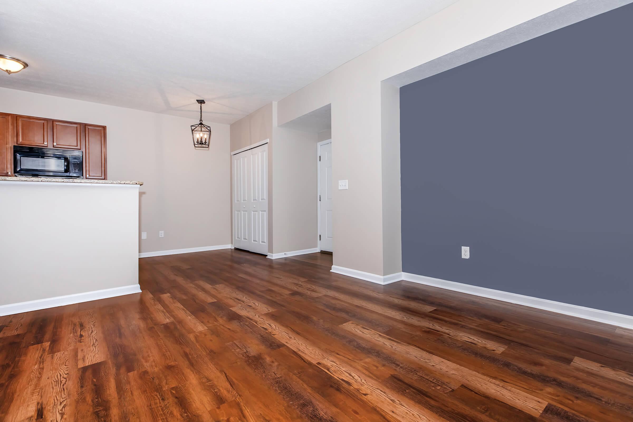 a large empty room with a wooden floor