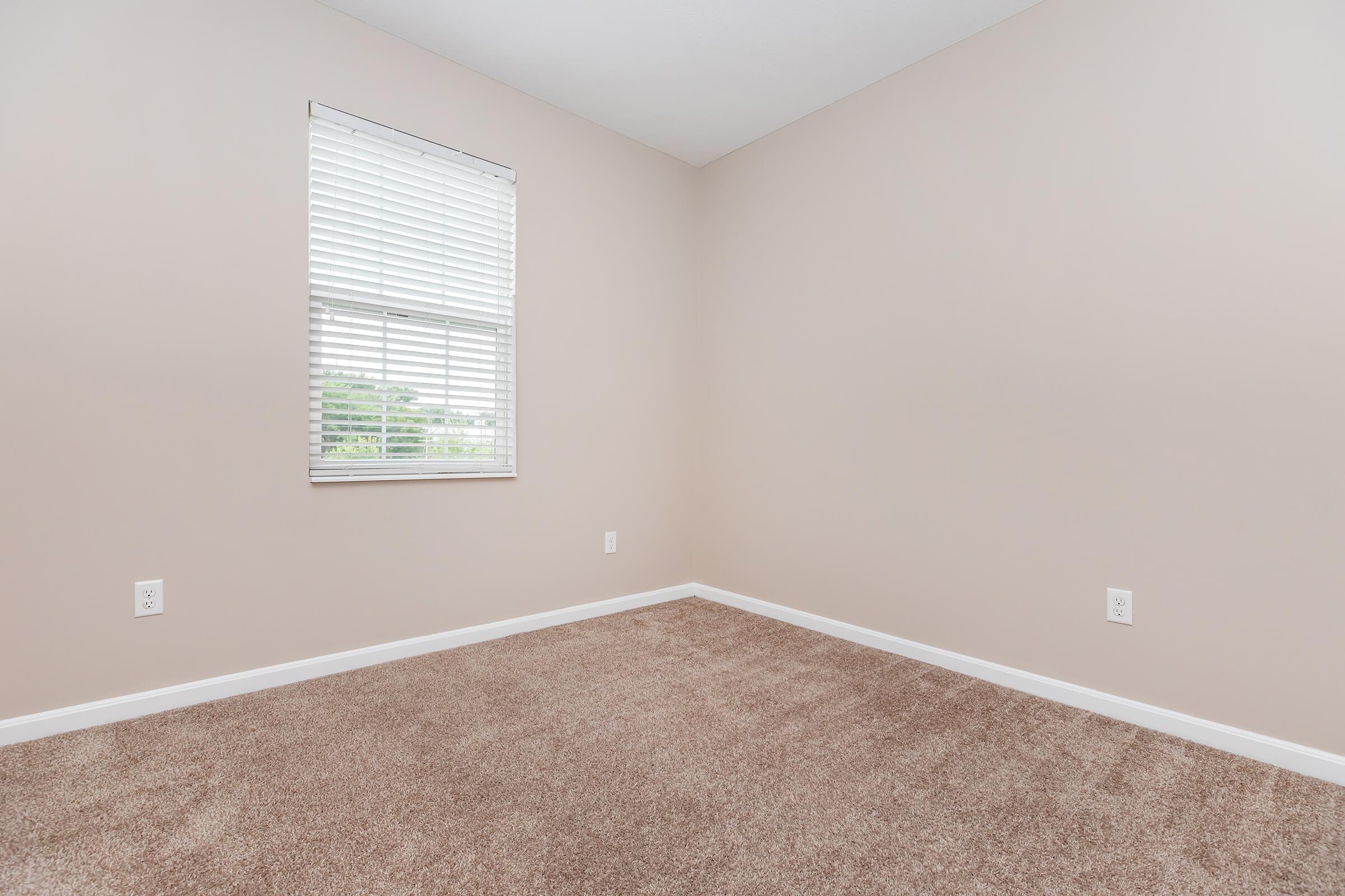 a bedroom with a large window