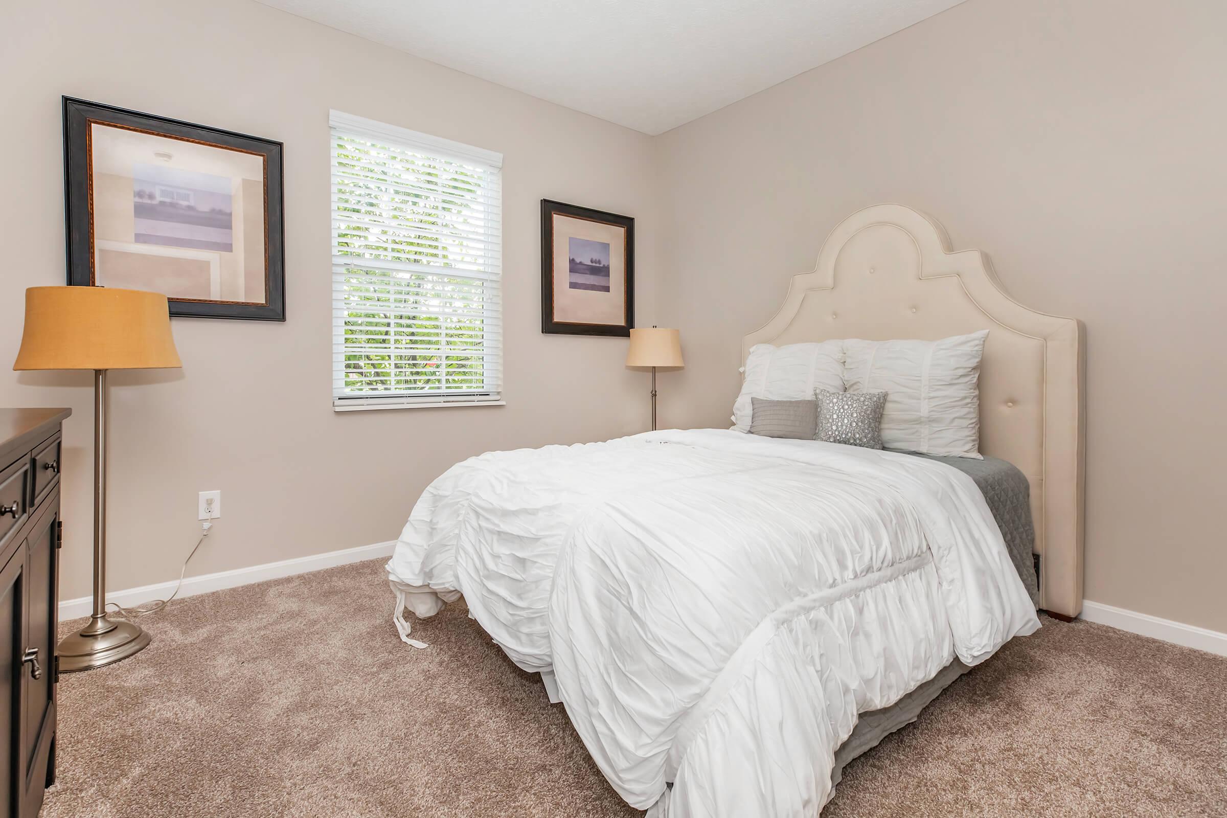 a bedroom with a bed in a hotel room