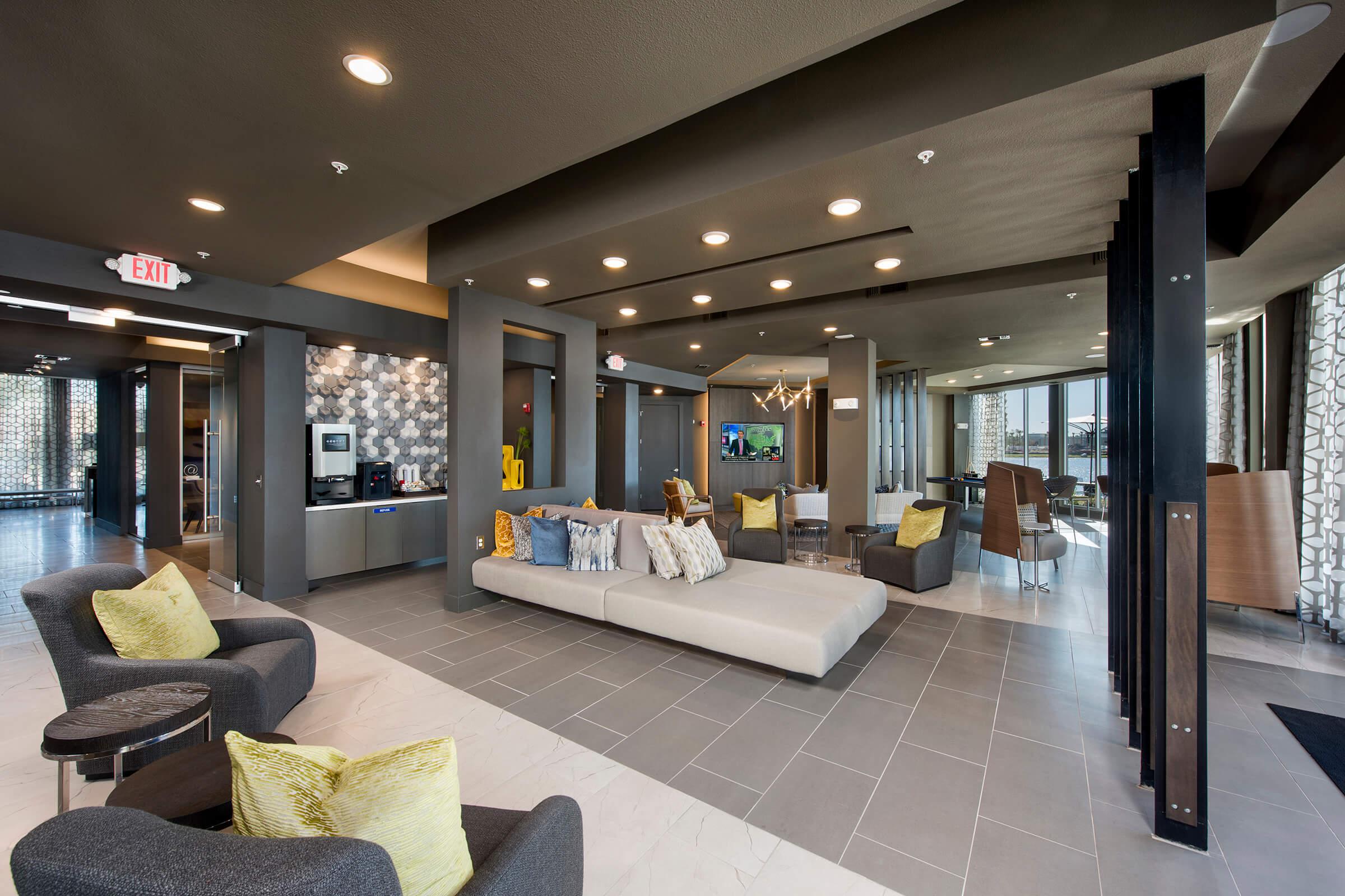 a living room filled with furniture and a large window