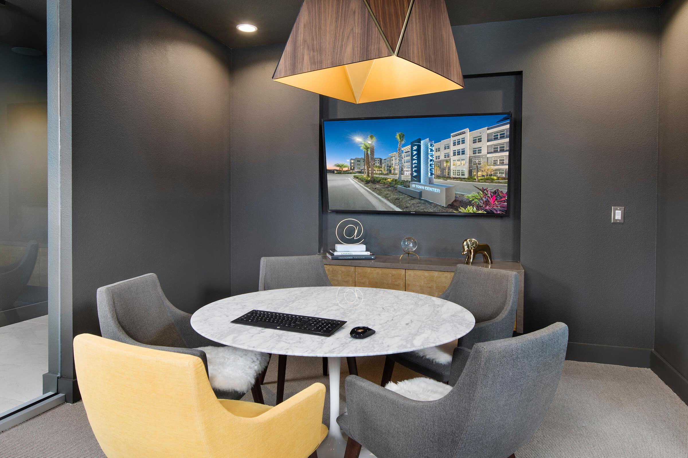 a hotel room with a couch and a chair
