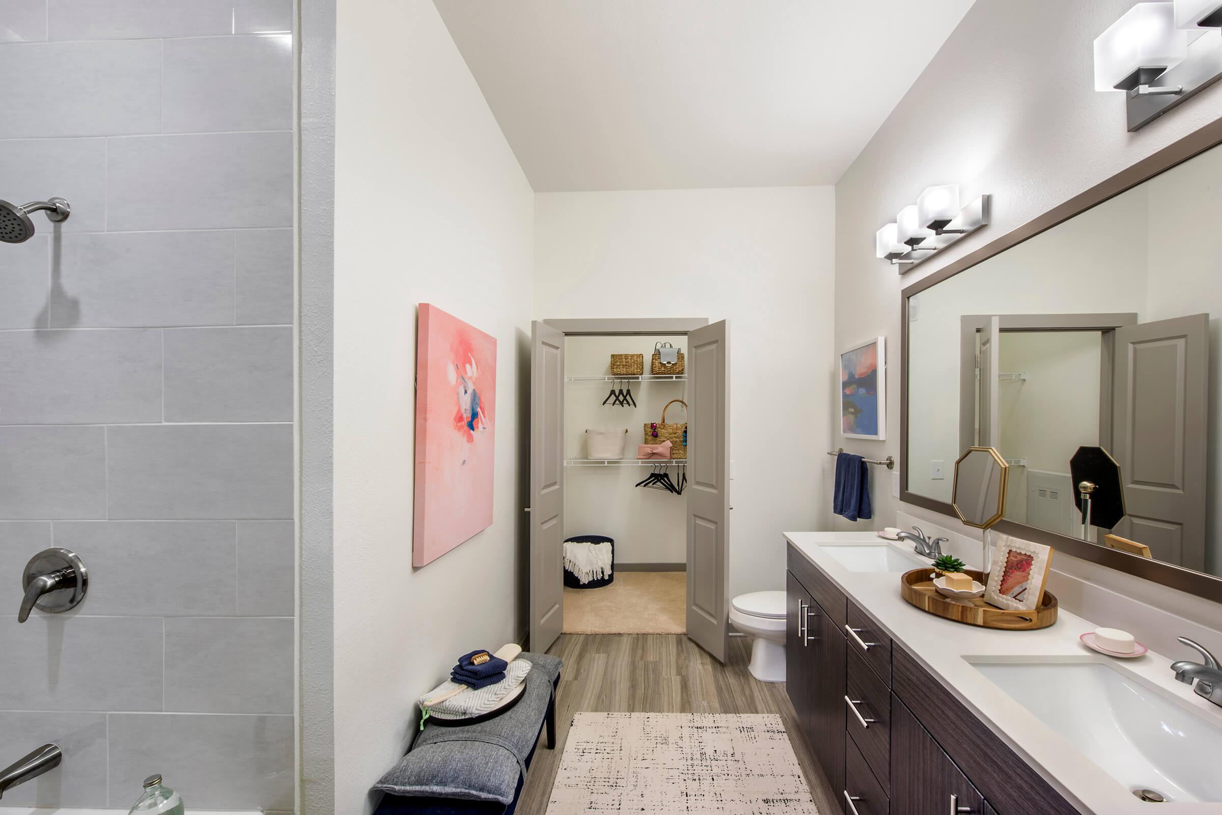 a kitchen with a sink and a mirror