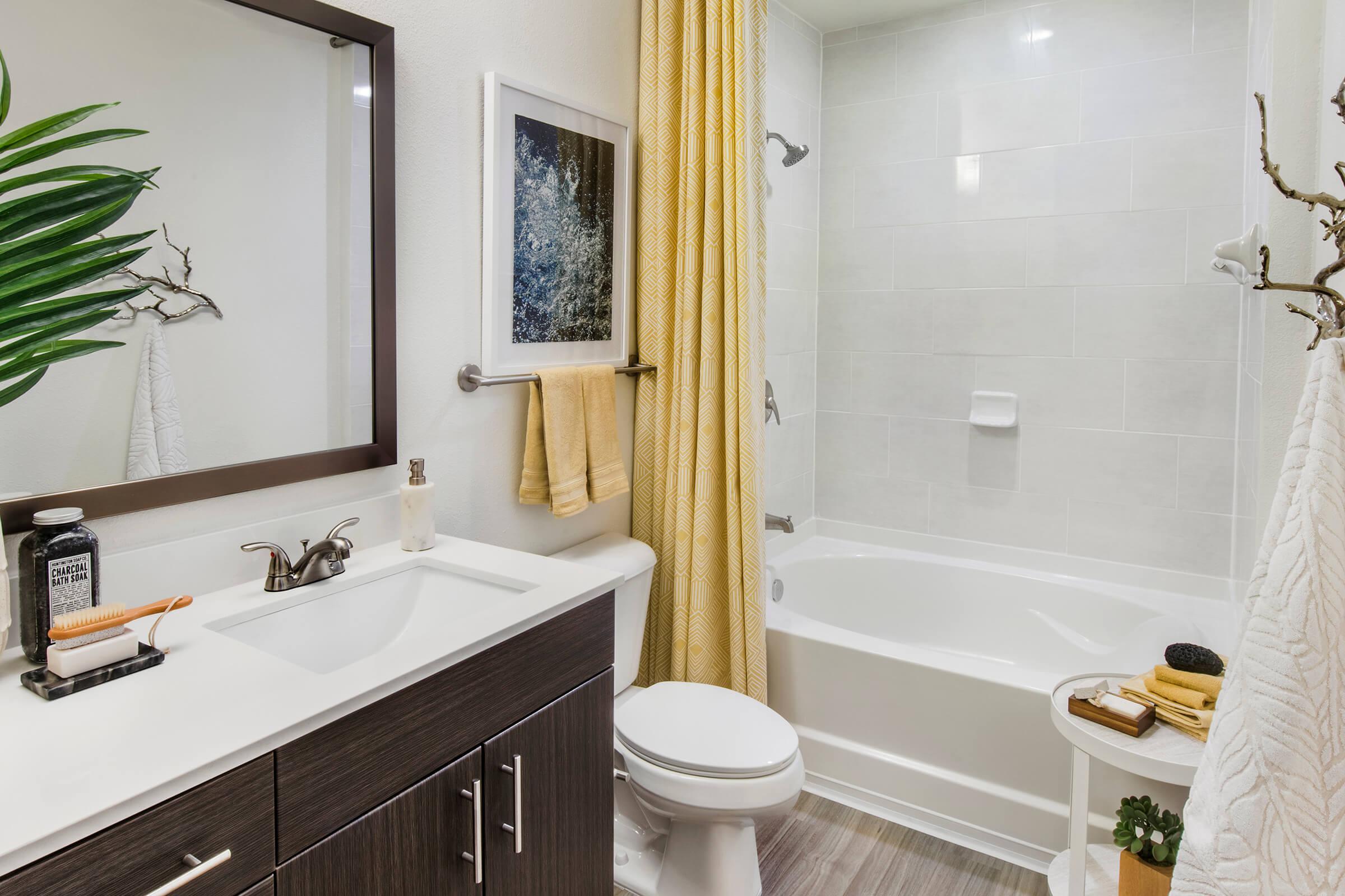 a room with a sink and a mirror