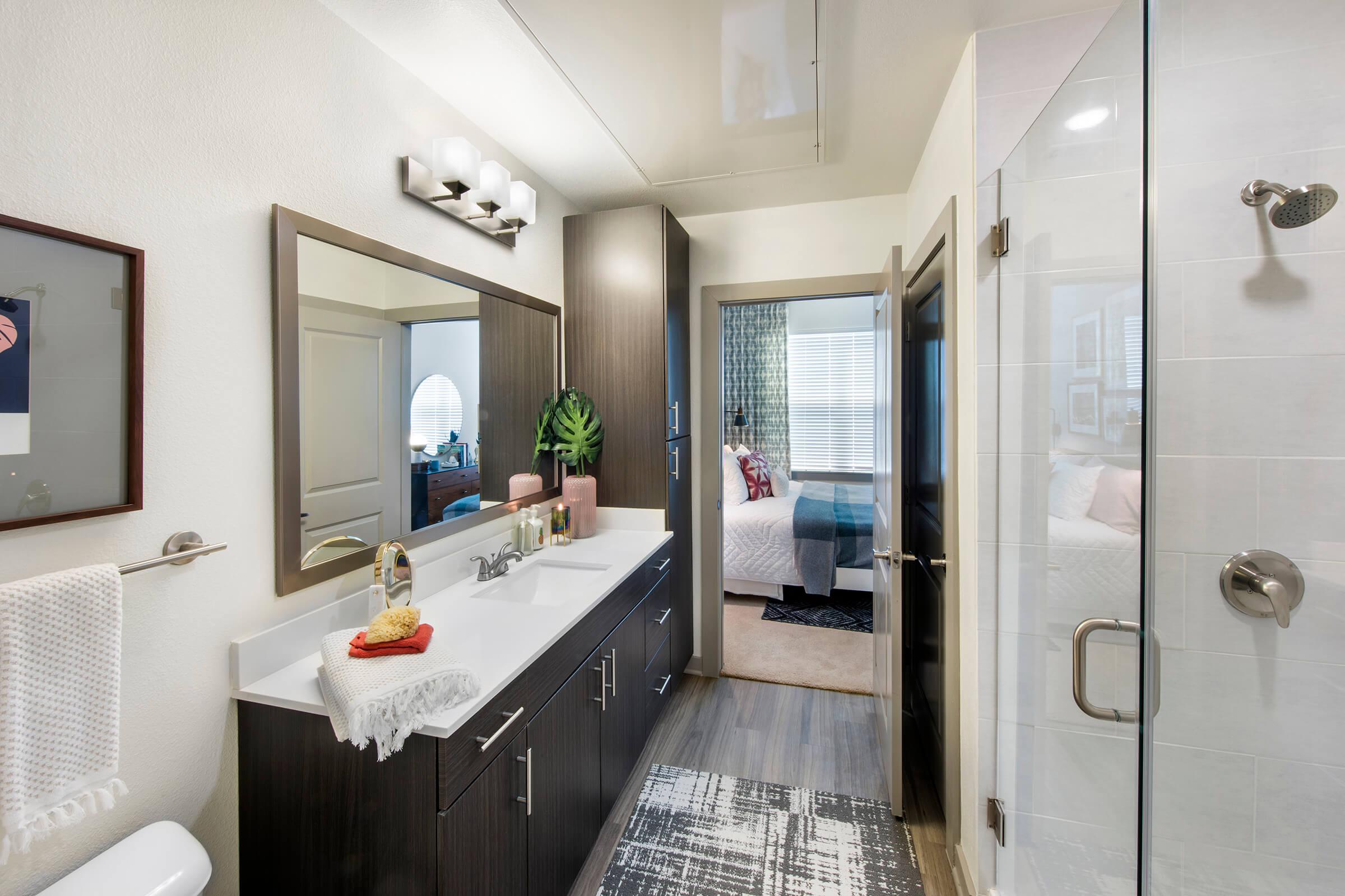 a room with a sink and a mirror