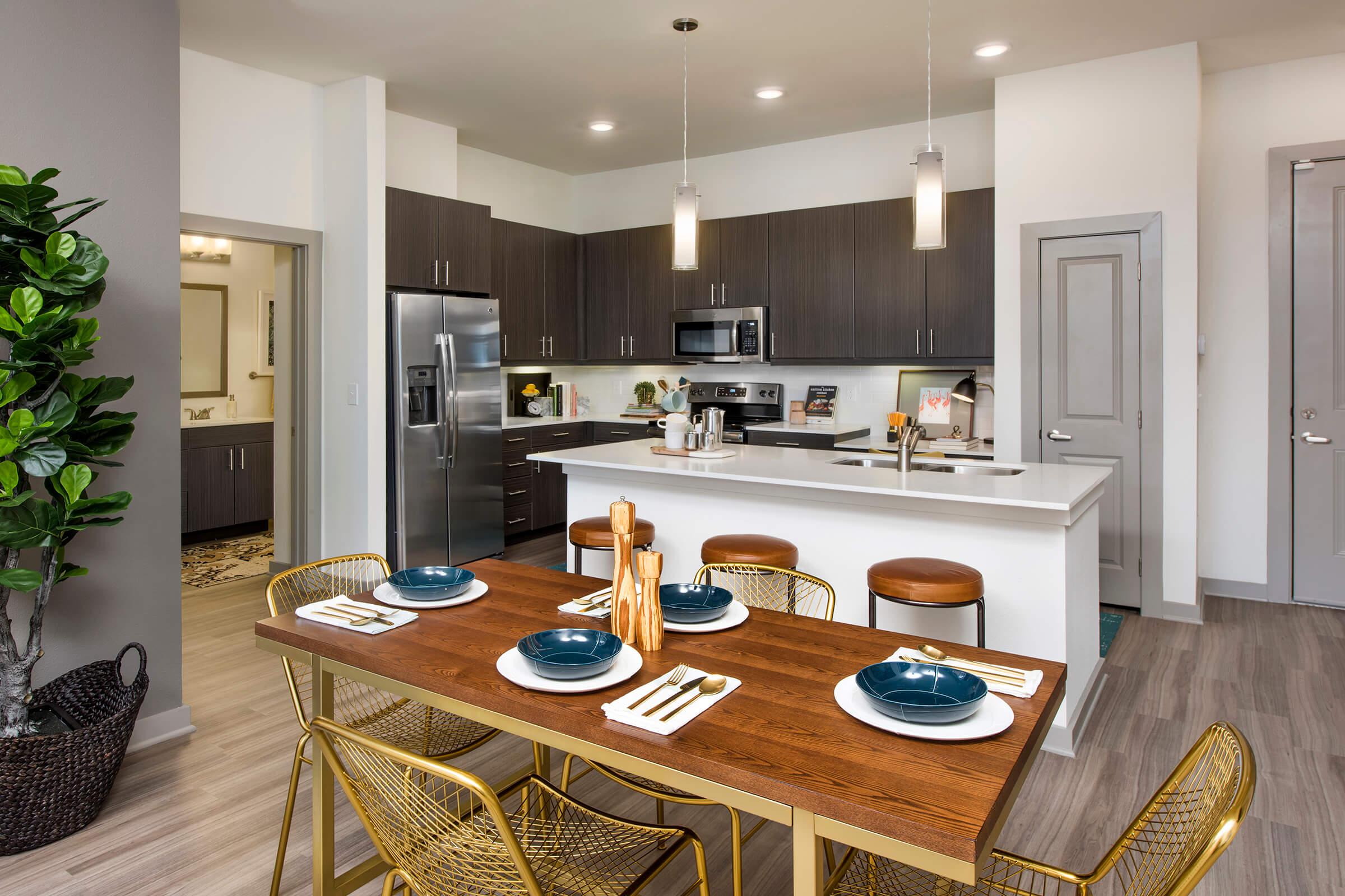 a kitchen with a dining table