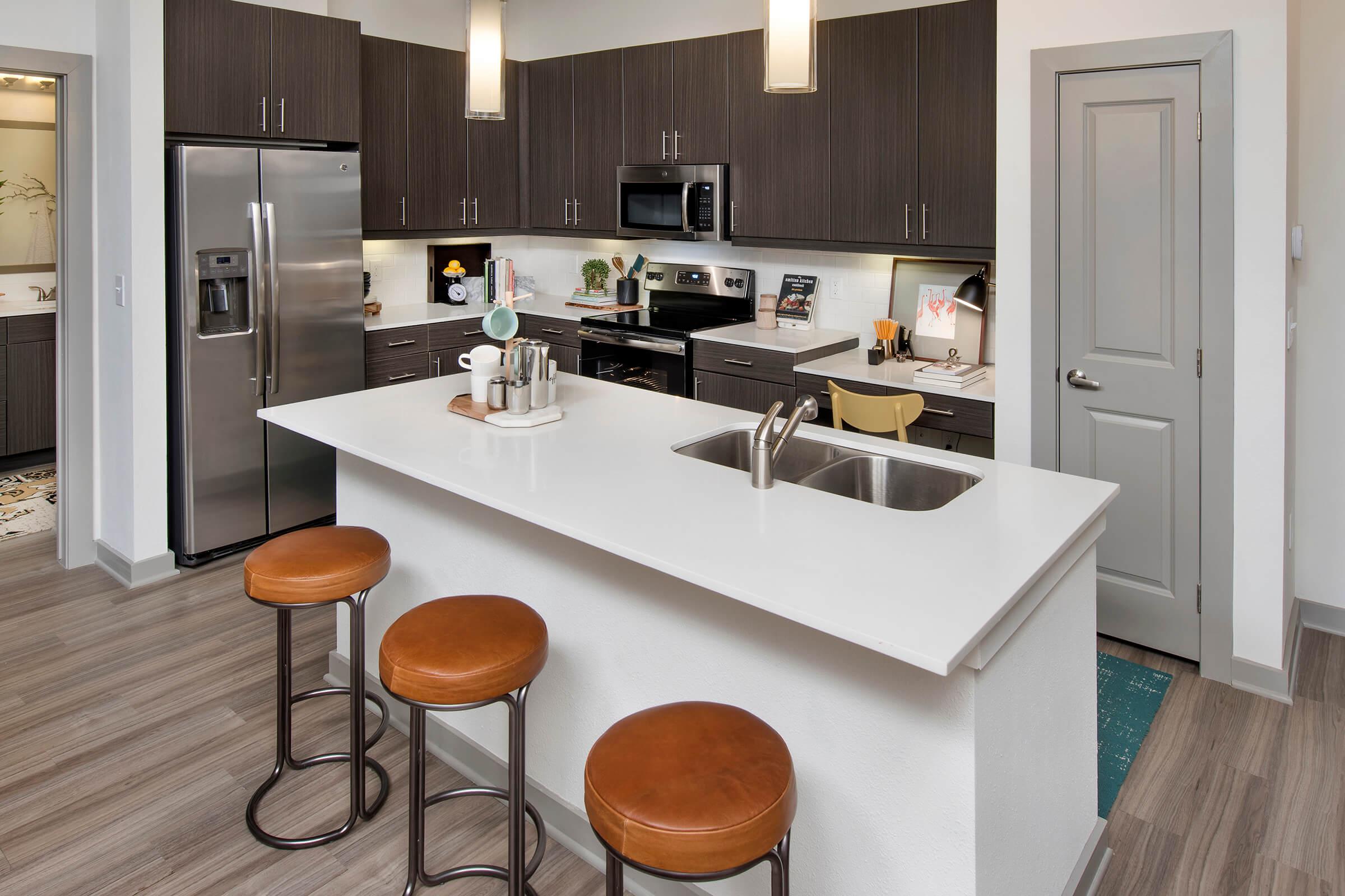 a modern kitchen with stainless steel appliances