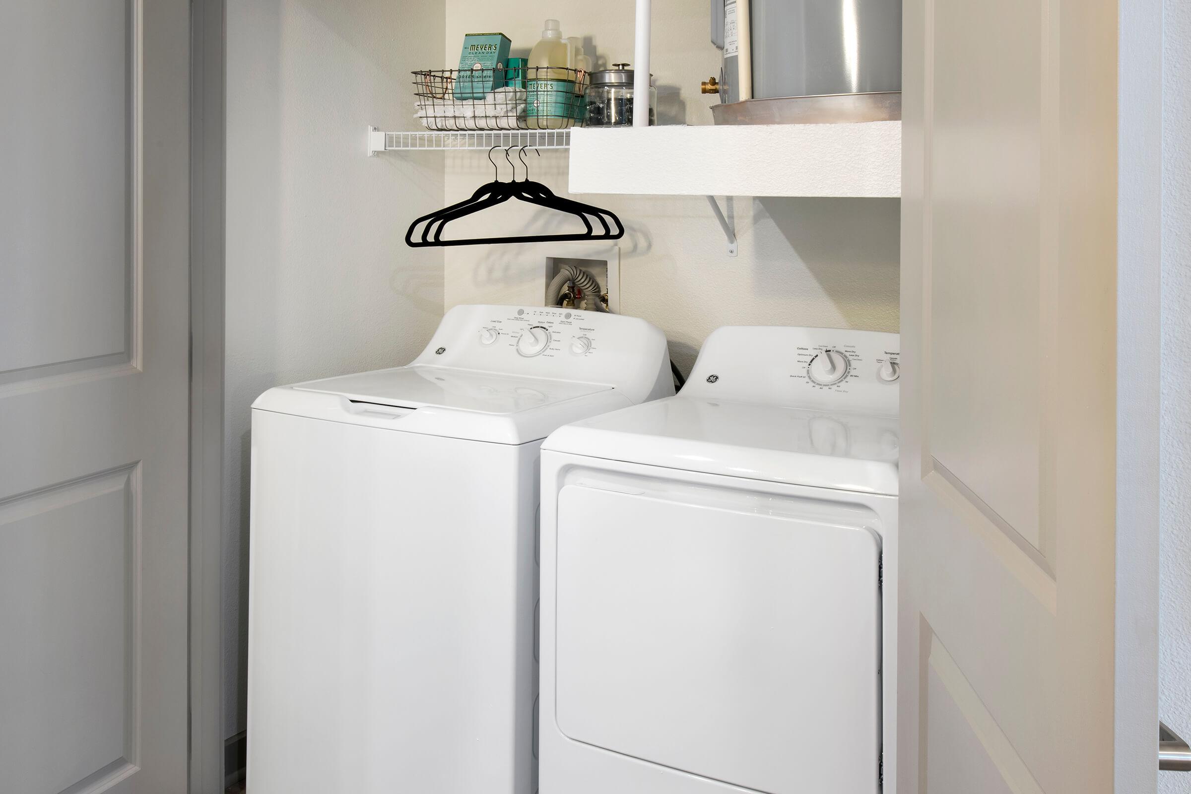 a microwave oven sitting on top of a refrigerator
