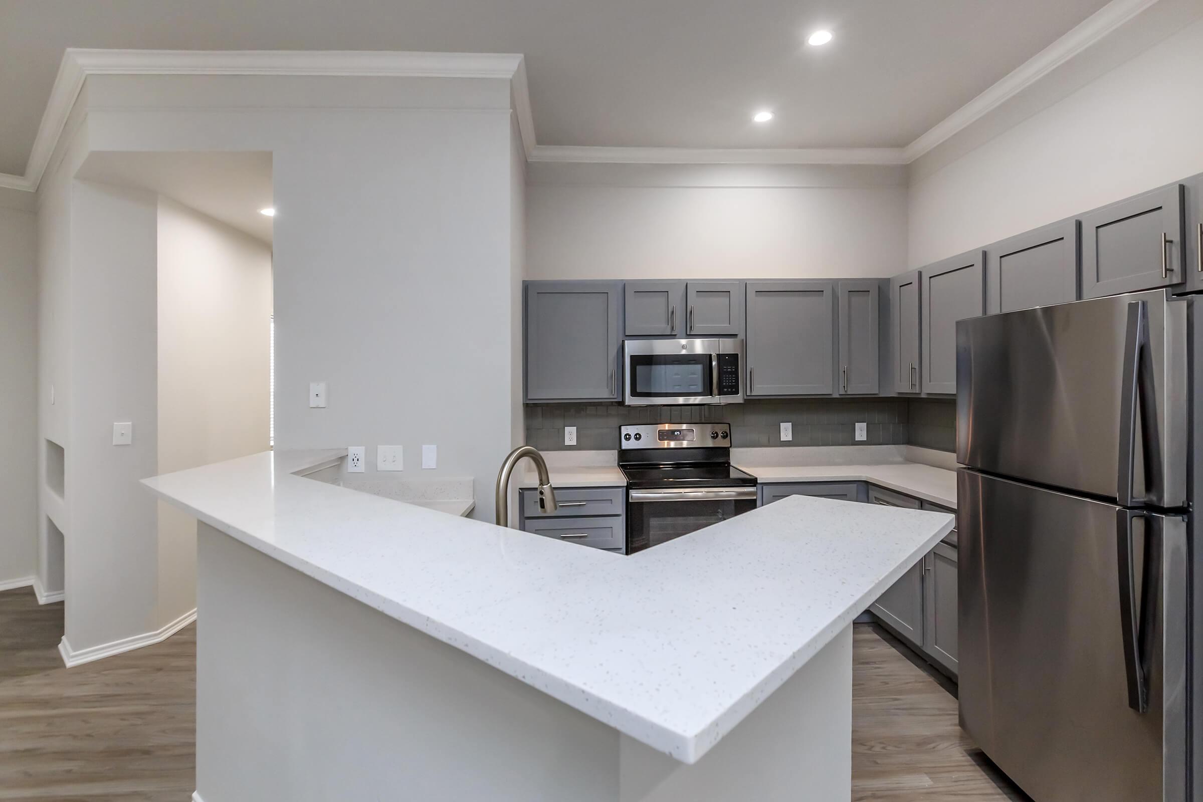 a modern kitchen with stainless steel appliances
