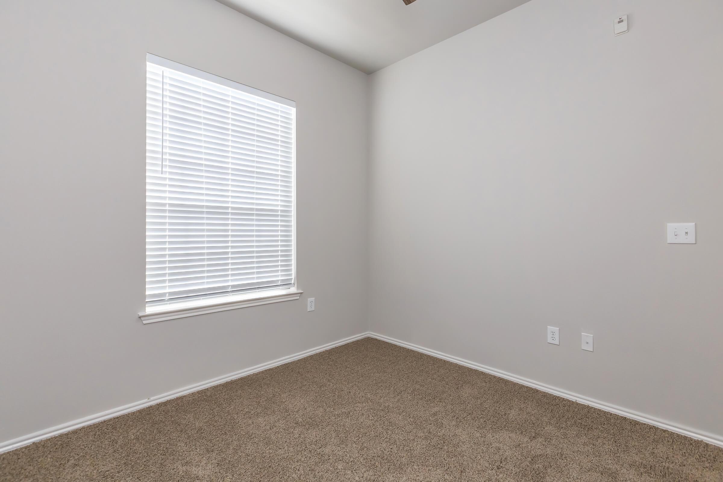 a white tub sitting next to a window