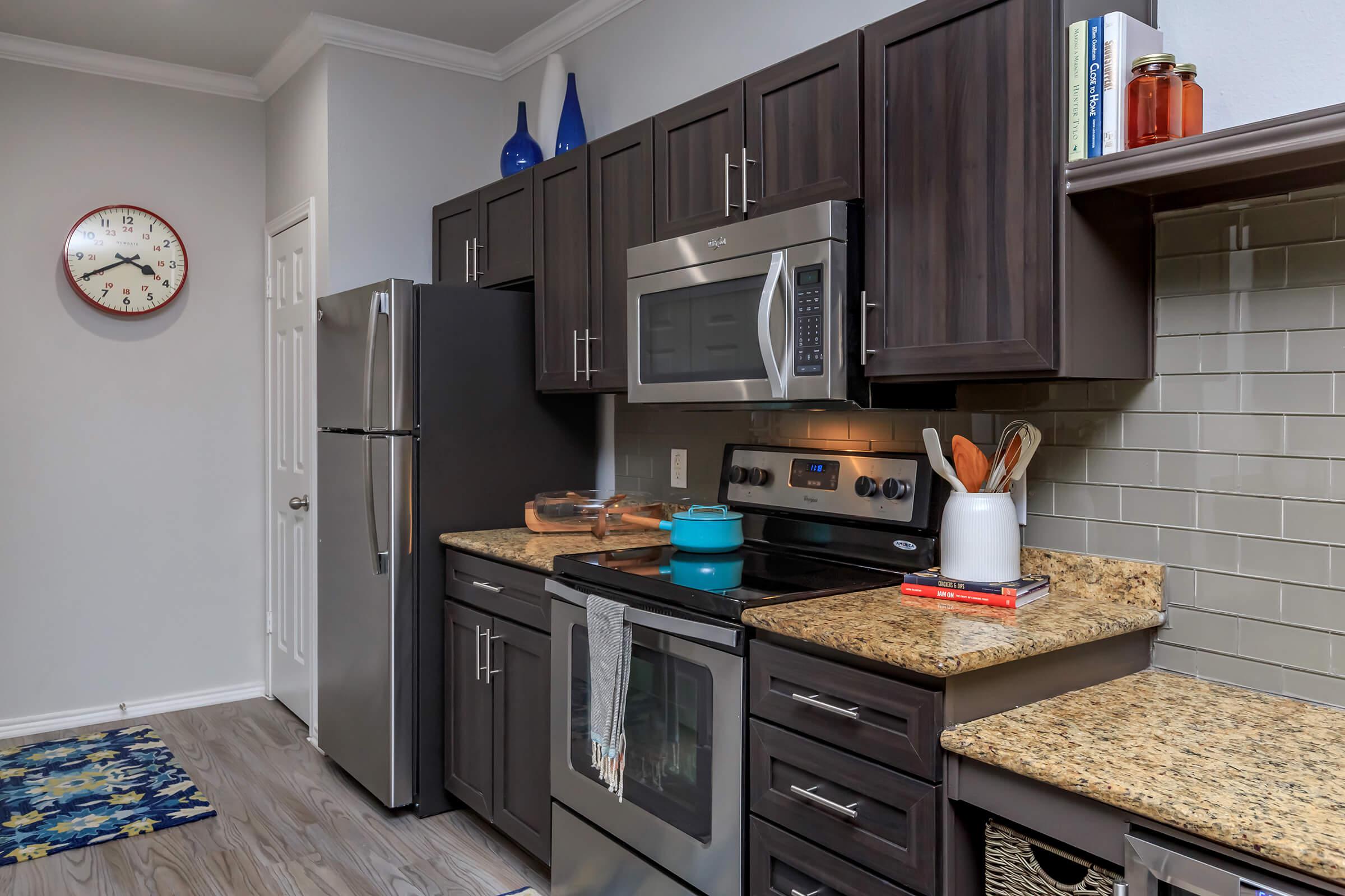 a kitchen with a sink and a counter in a room