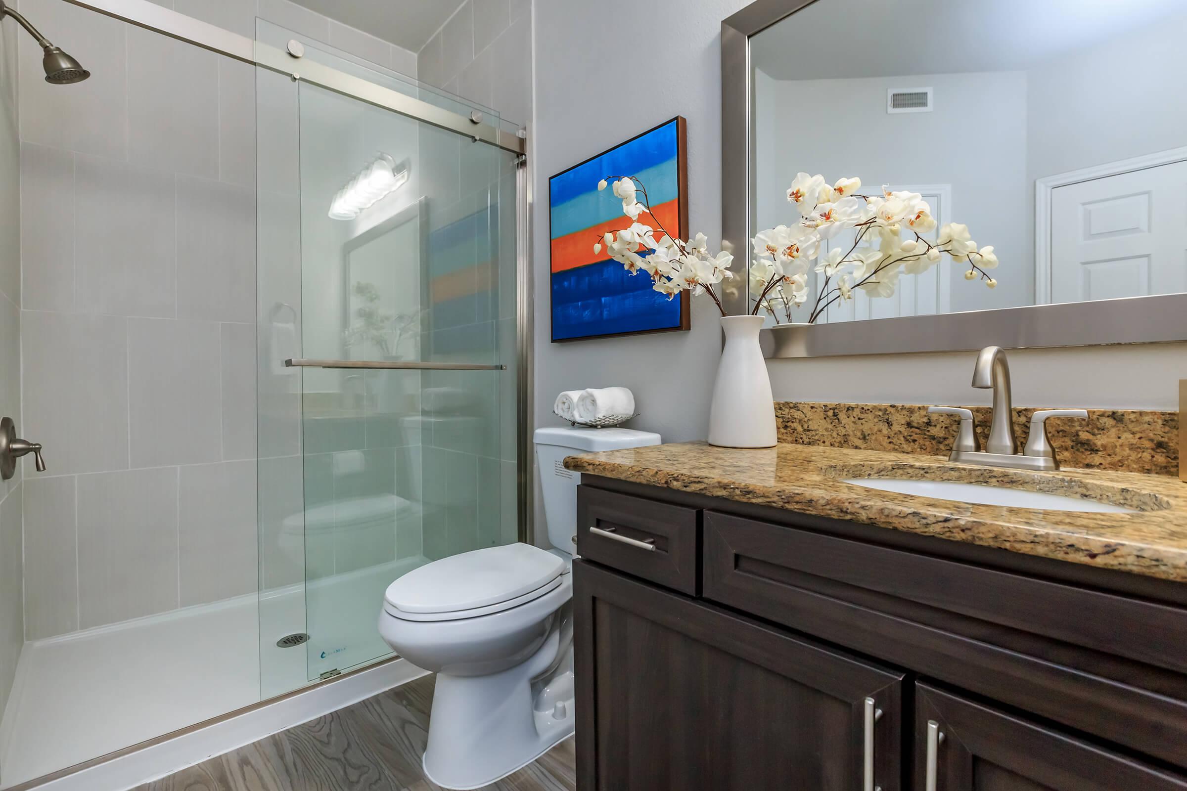 a room with a sink and a mirror