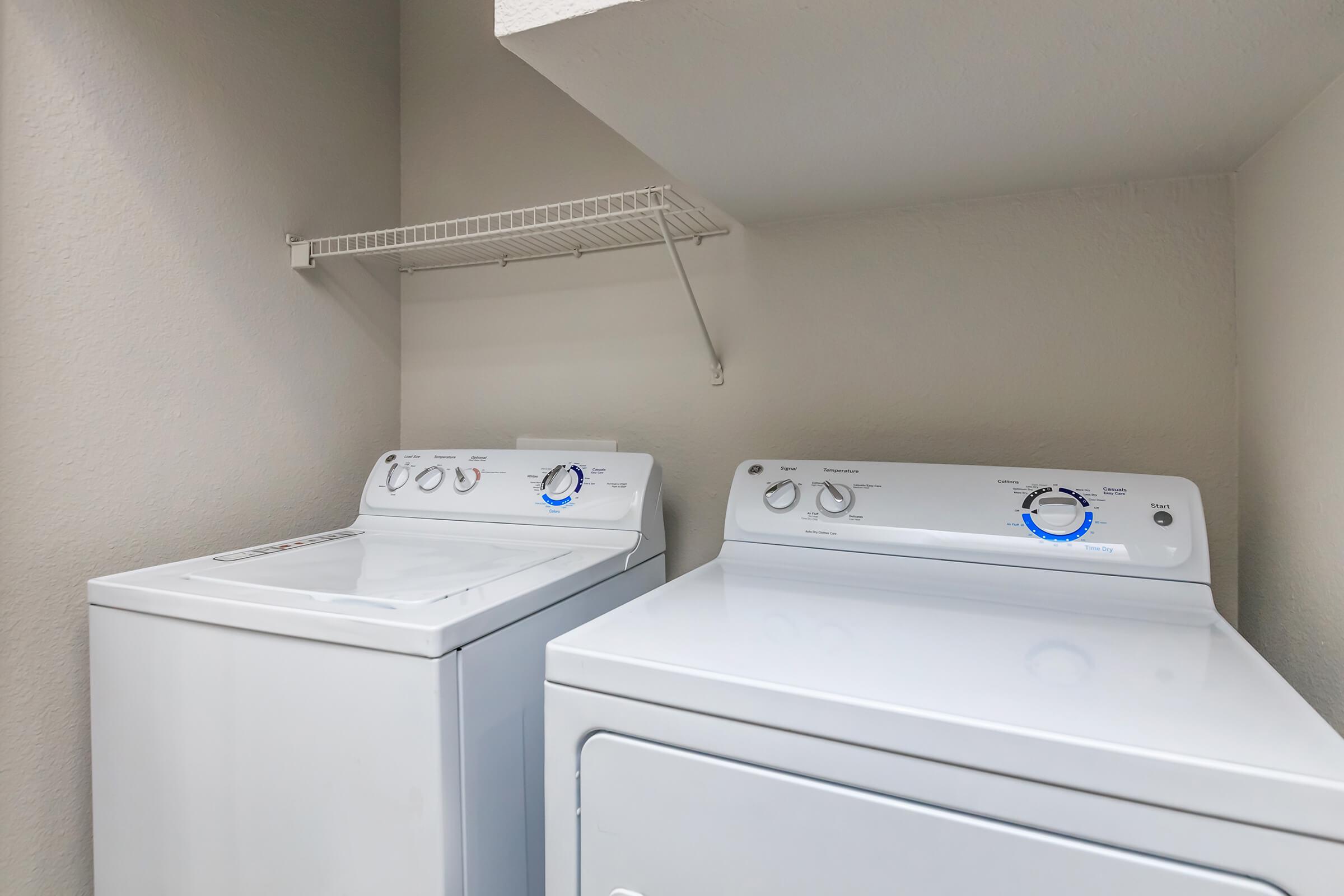a white refrigerator freezer sitting next to a sink