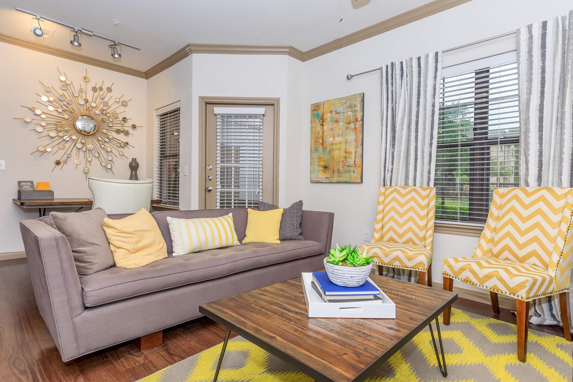 a living room filled with furniture and a fire place