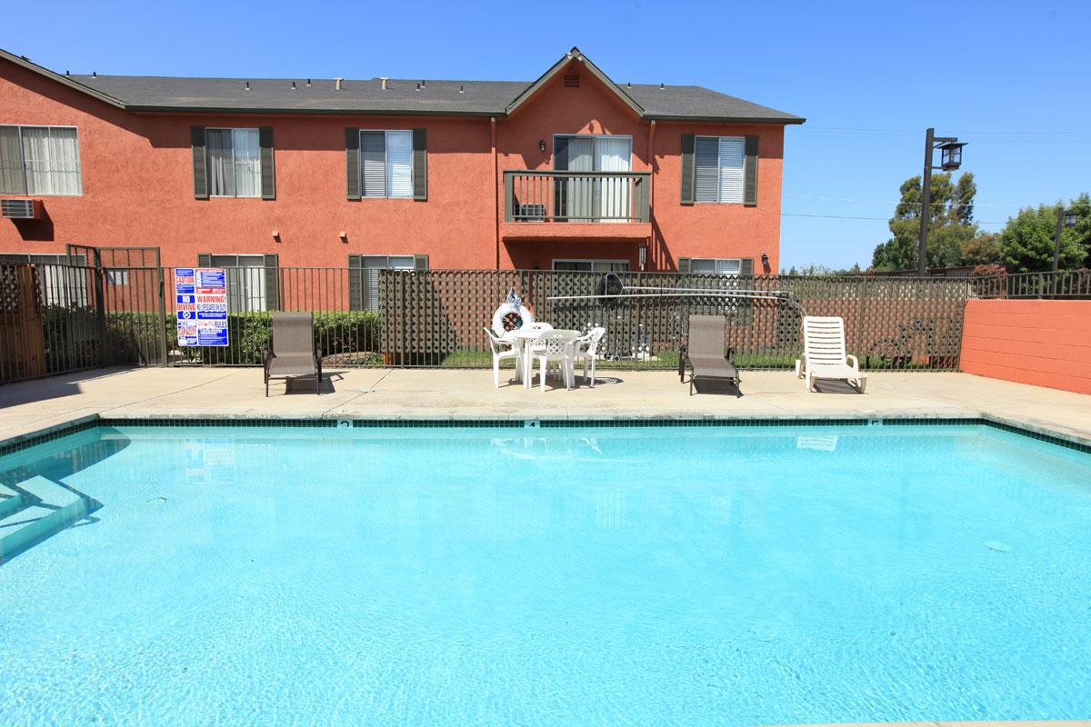 a large pool of water in front of a house