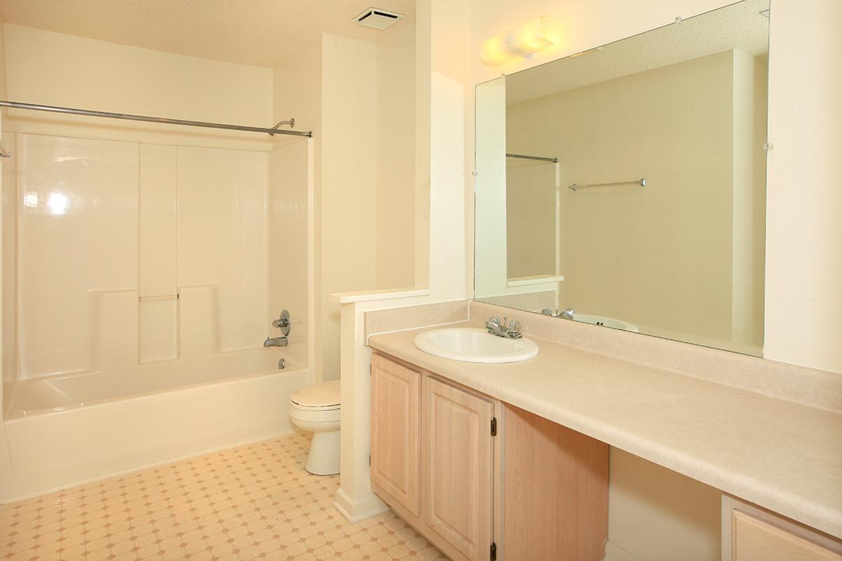 a room with a sink and a mirror