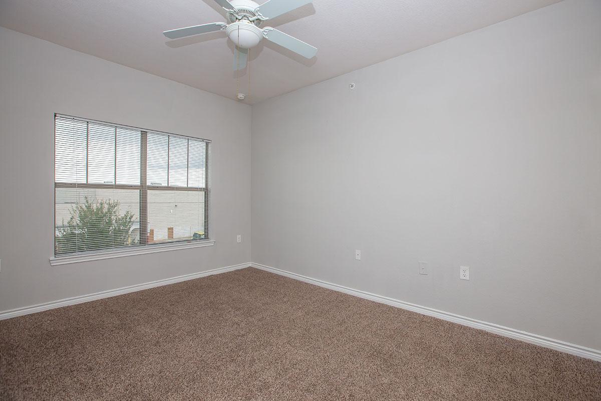 a bedroom with a large window