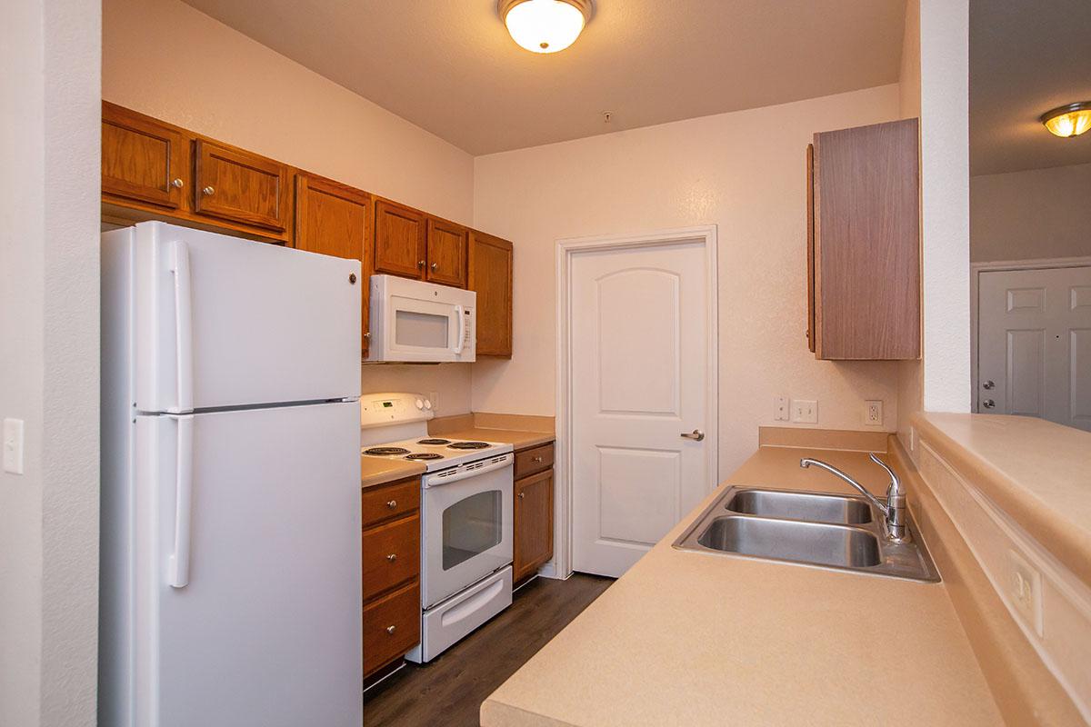 a kitchen with a stove top oven sitting inside of a refrigerator