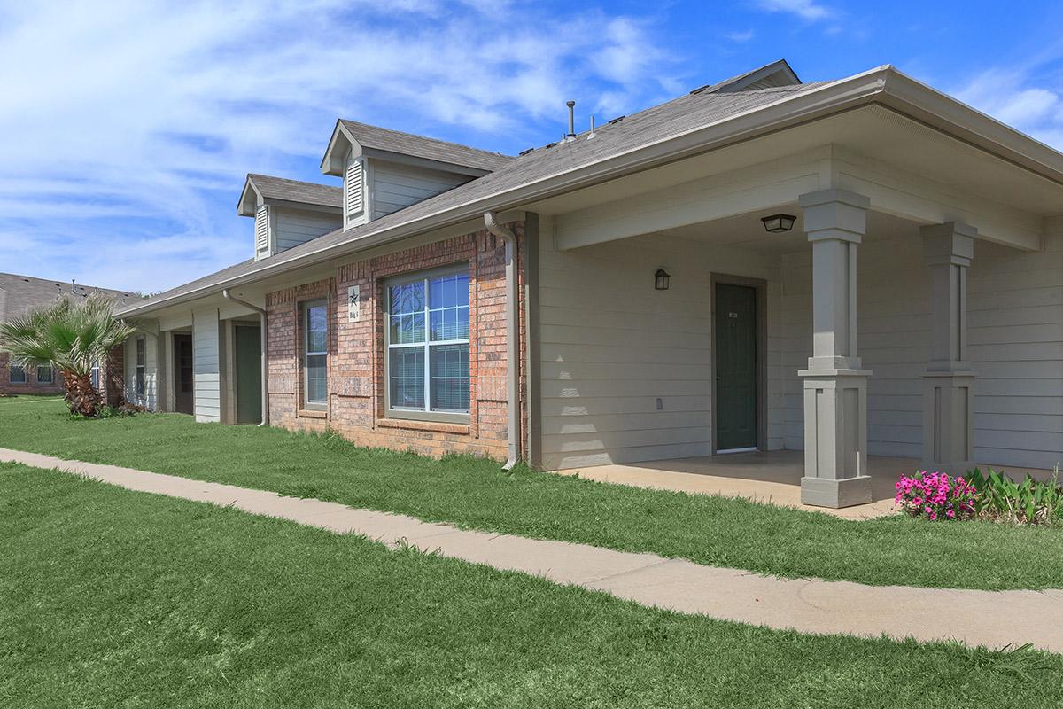 a large lawn in front of a house