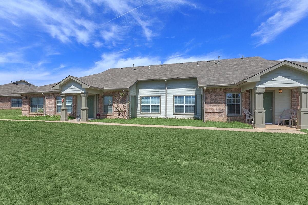 a large lawn in front of a house