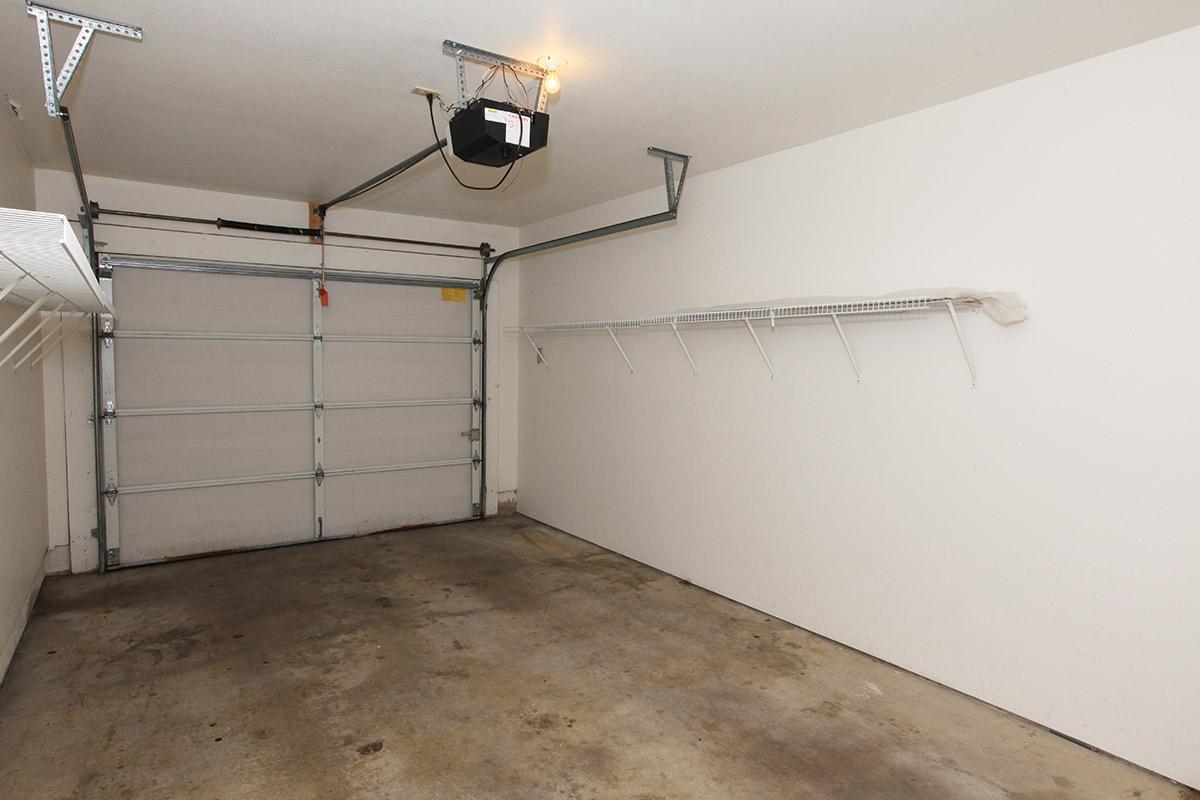 a white refrigerator freezer sitting inside of a building