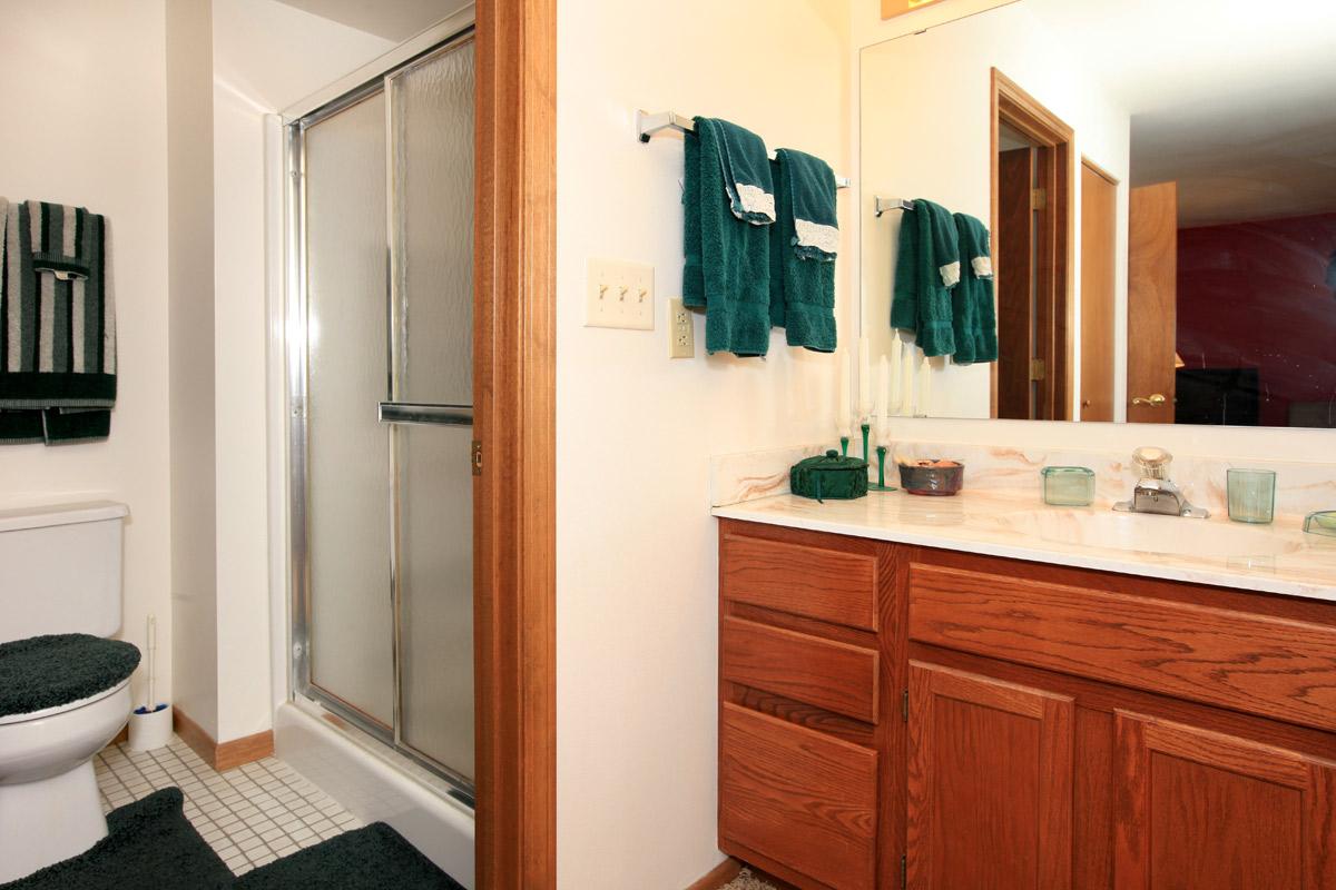 a kitchen with a sink and a mirror