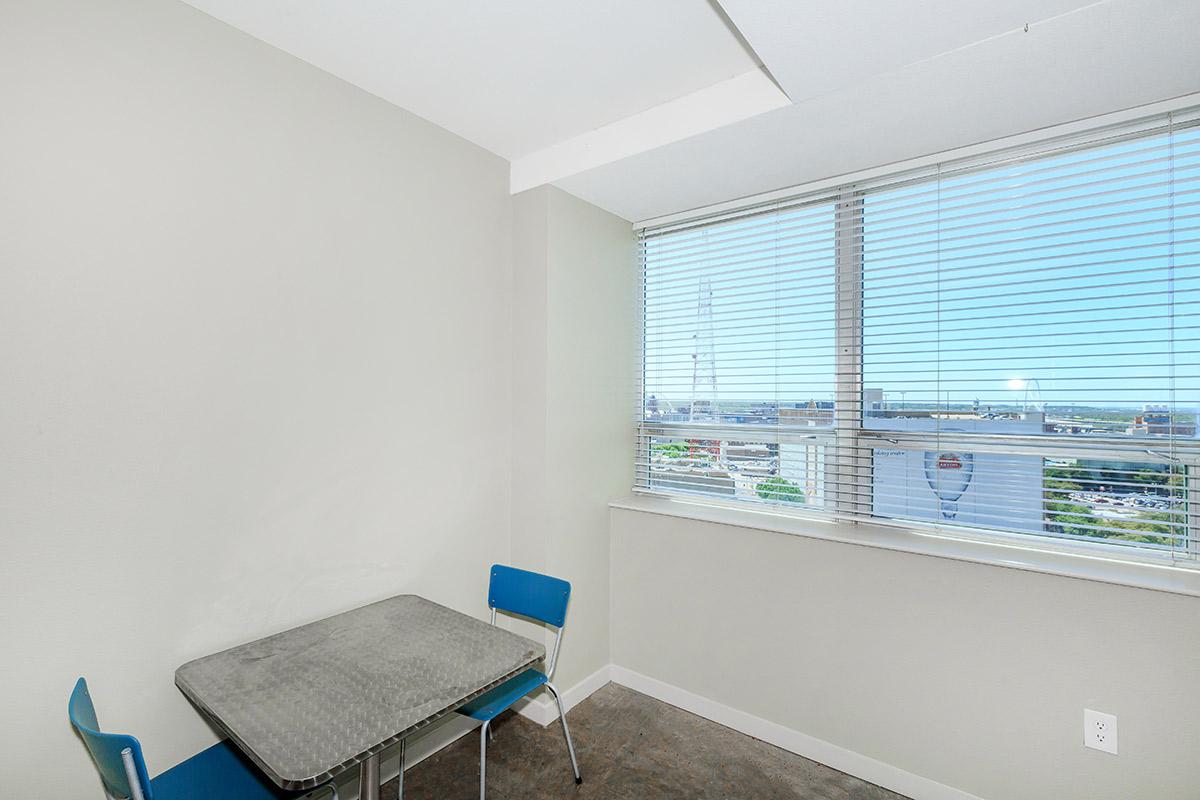 a room filled with furniture and a window