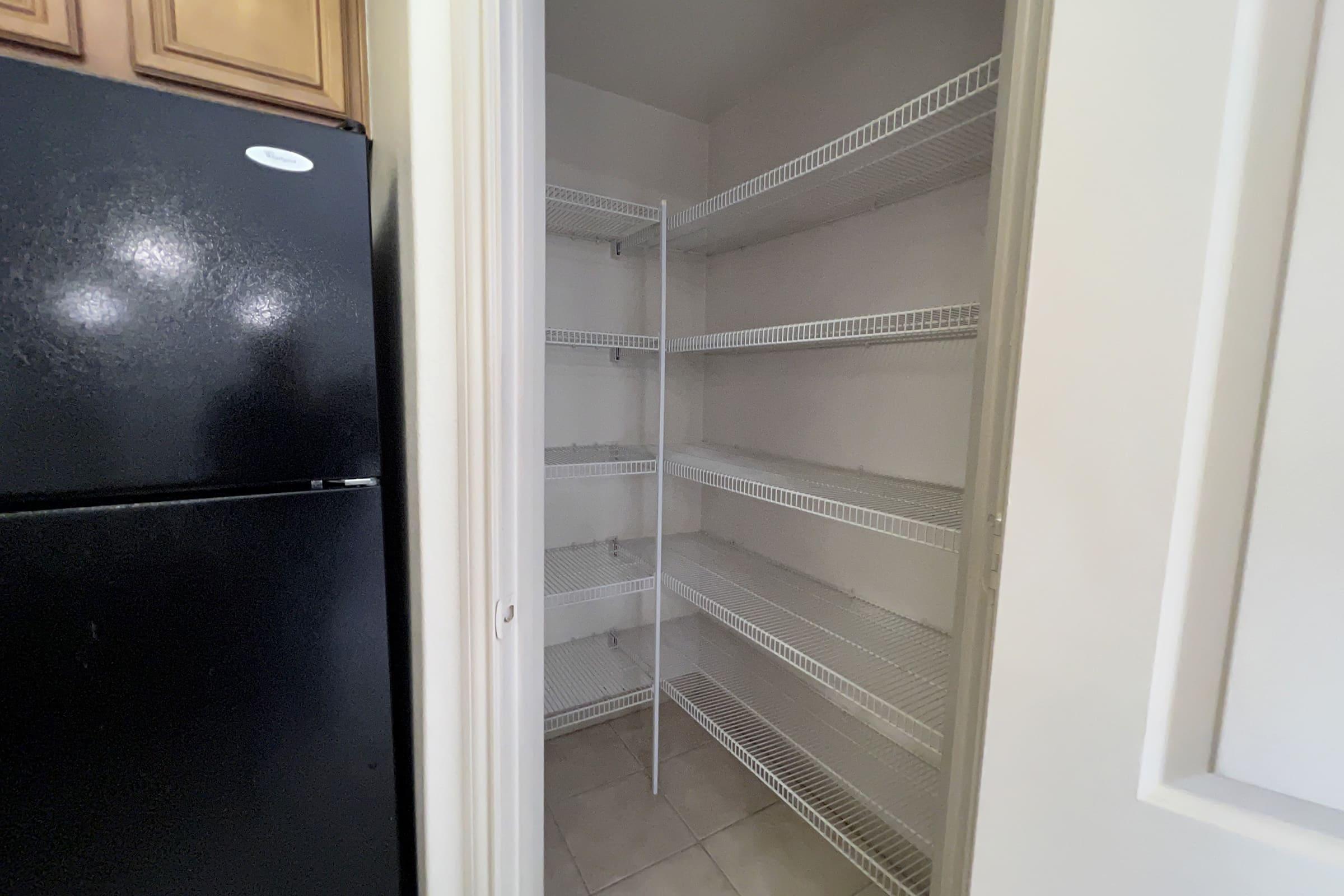 a stainless steel refrigerator in a room