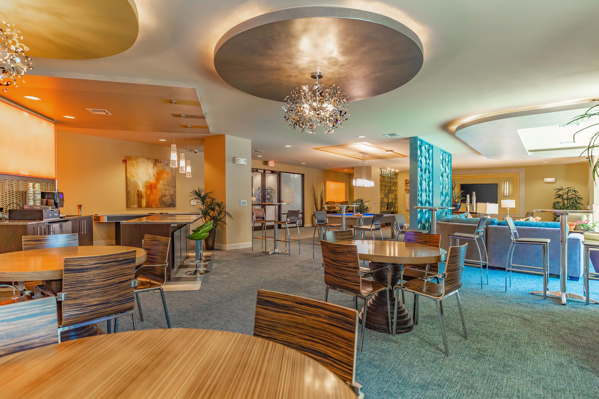 San Antigua community room with tables and chairs