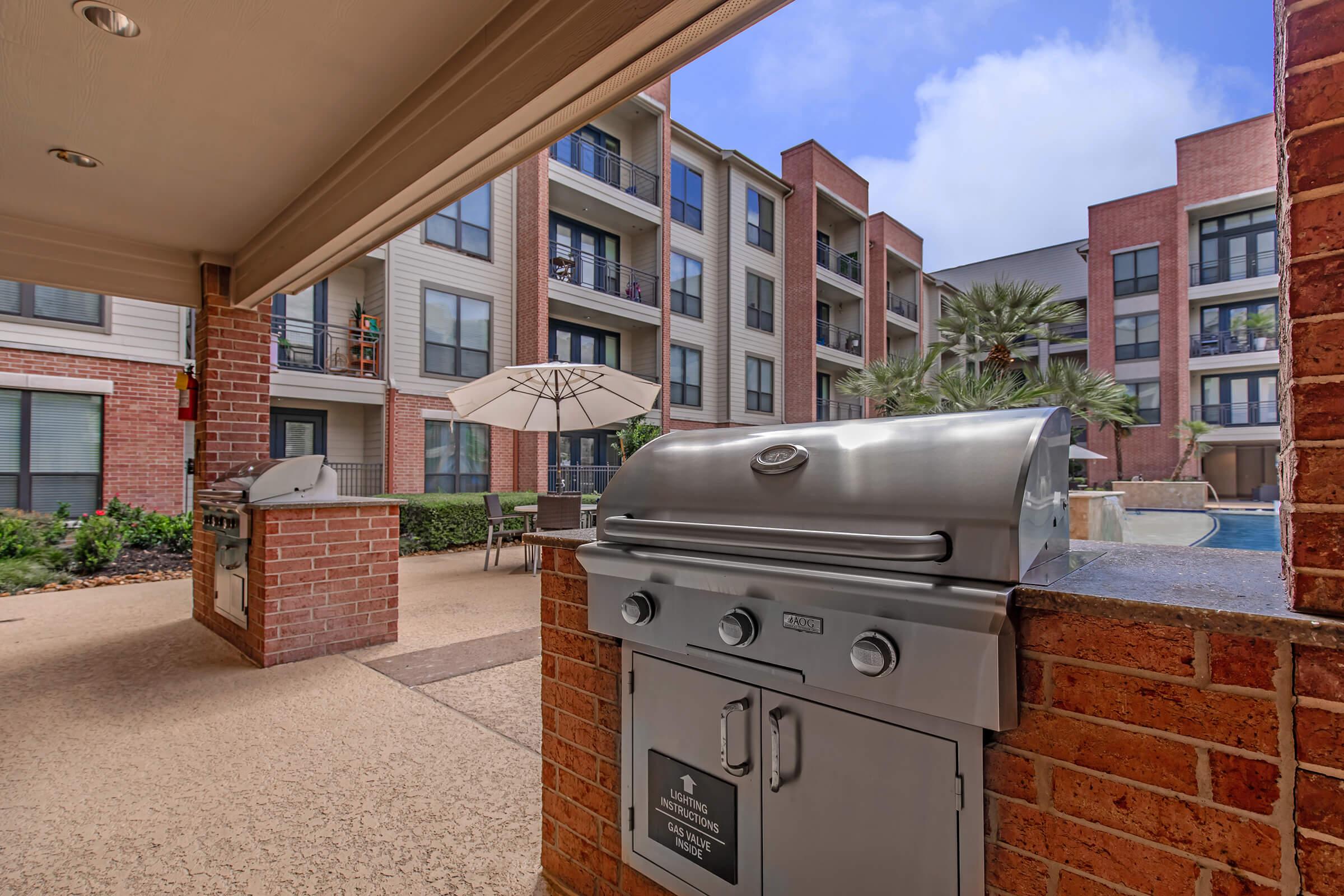 a stove top oven sitting inside of a brick building