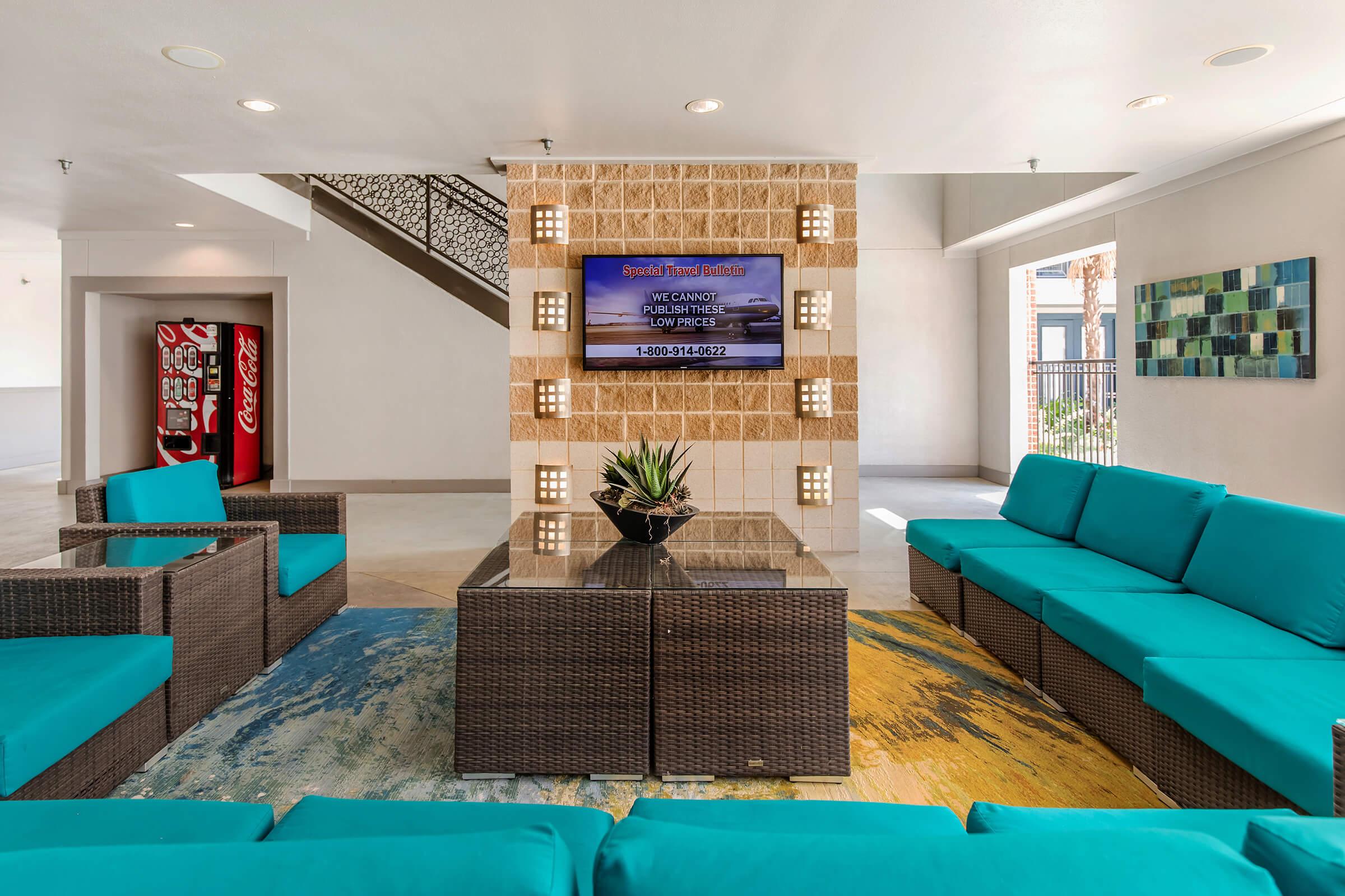 a living room filled with furniture and a flat screen tv