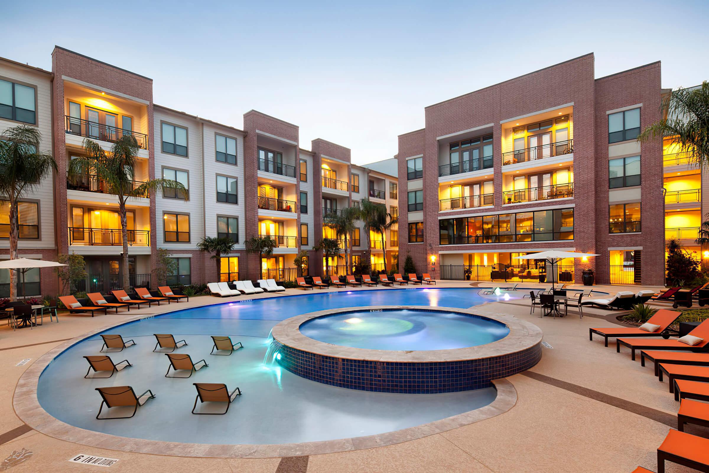 a community pool and community spa at dusk