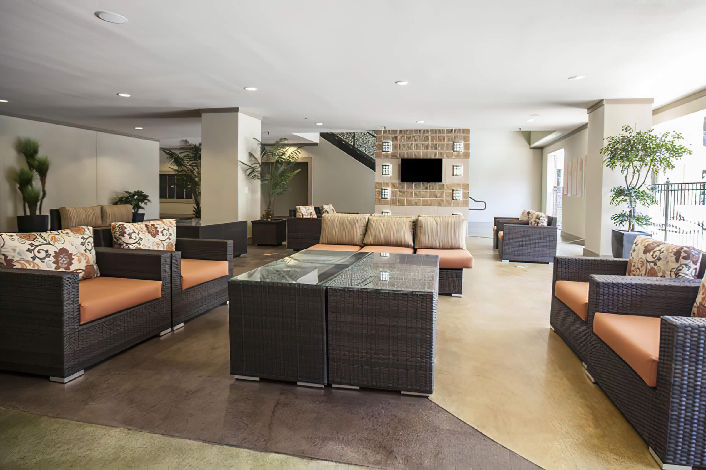 a living room filled with furniture and a table