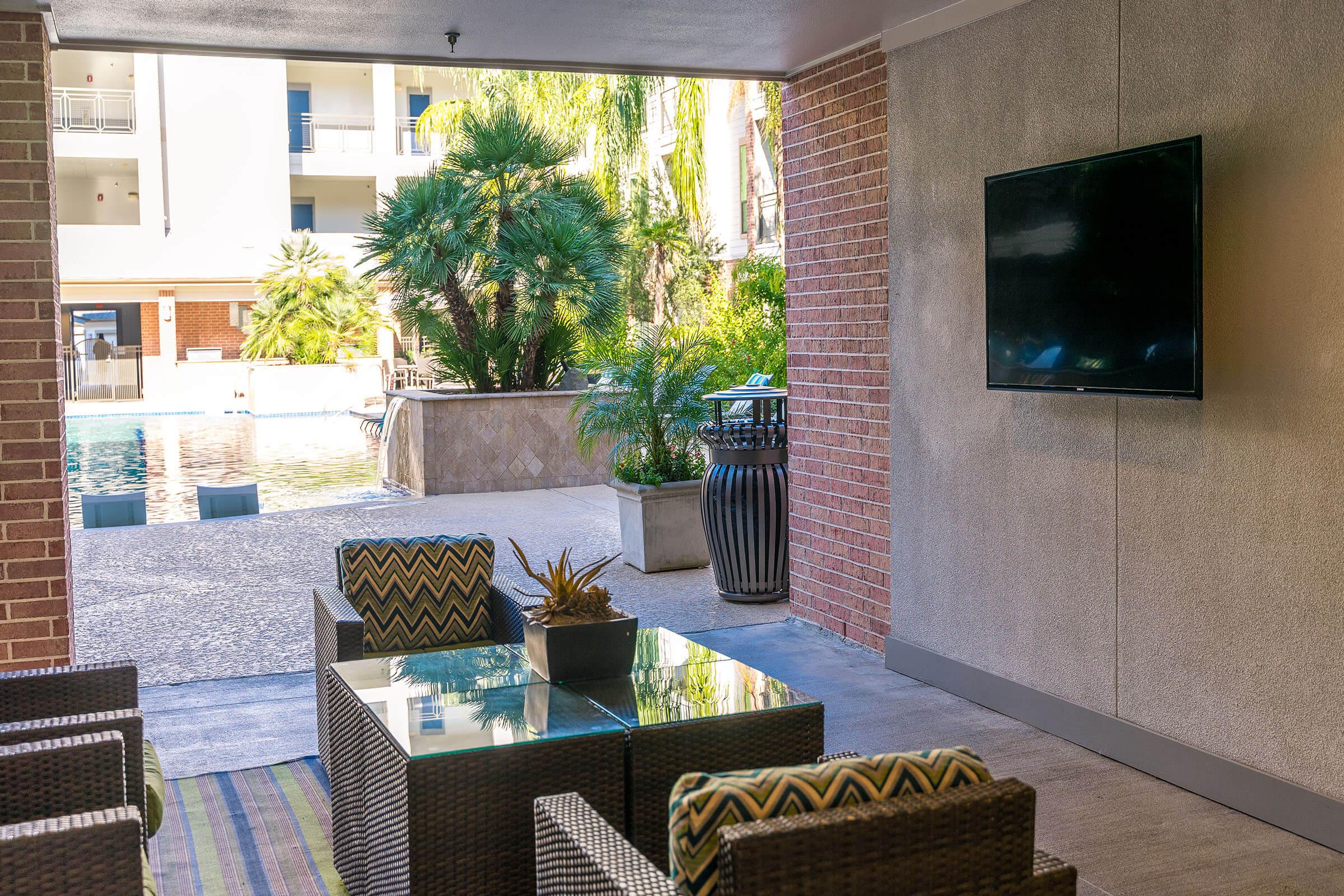 outdoor patio with a table and chairs