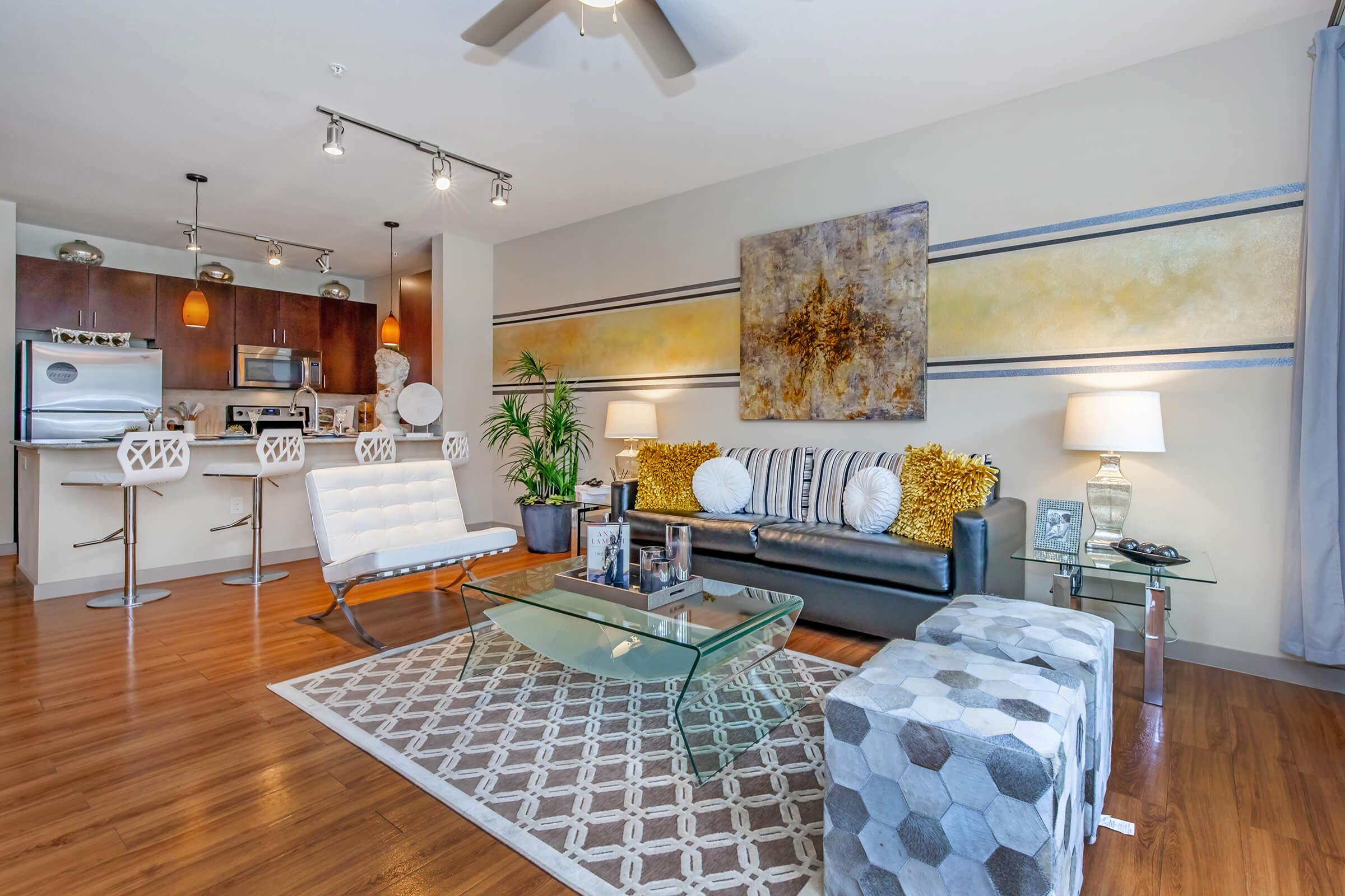 a living room filled with furniture and a fireplace