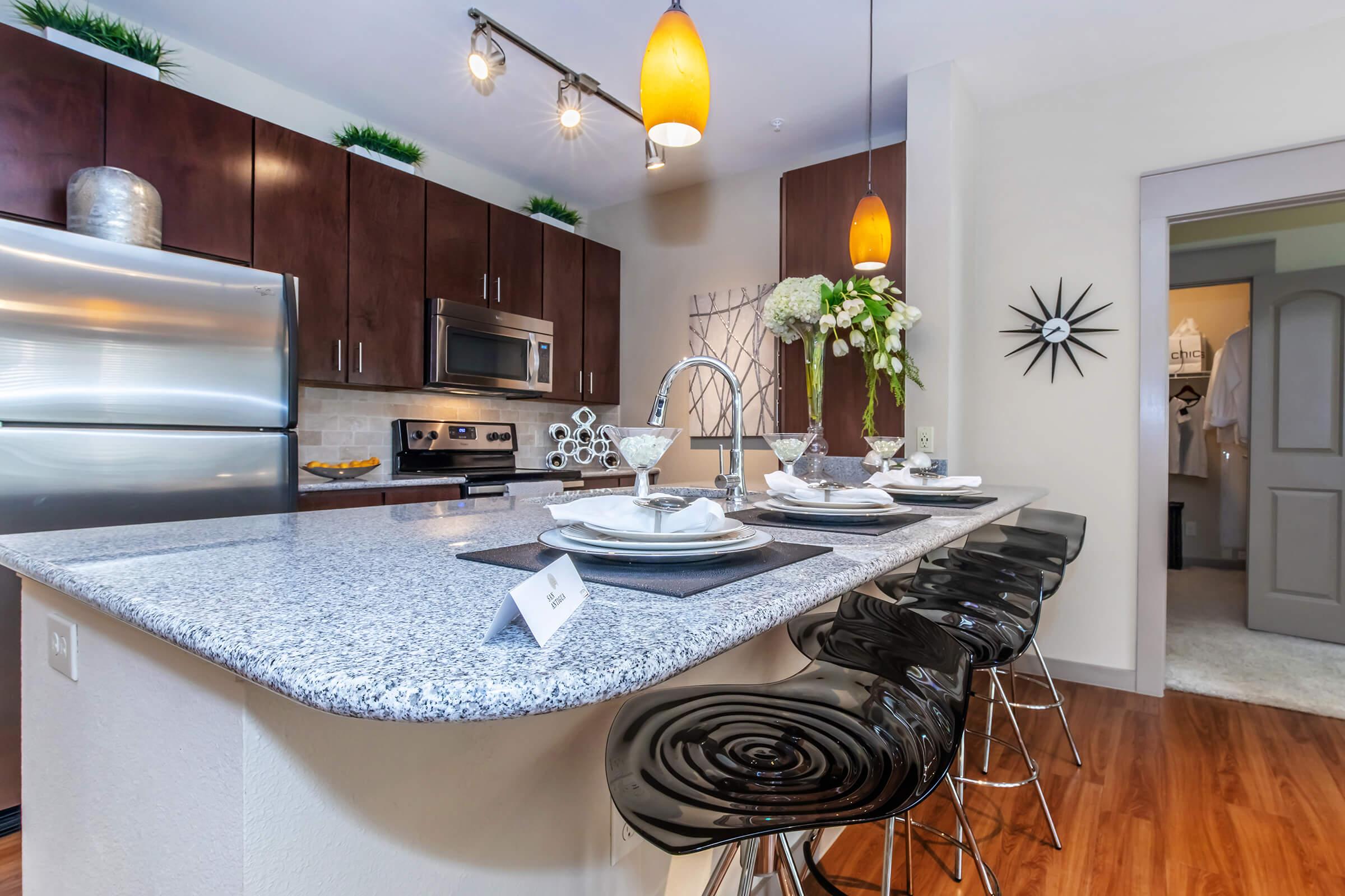 a modern kitchen with stainless steel appliances