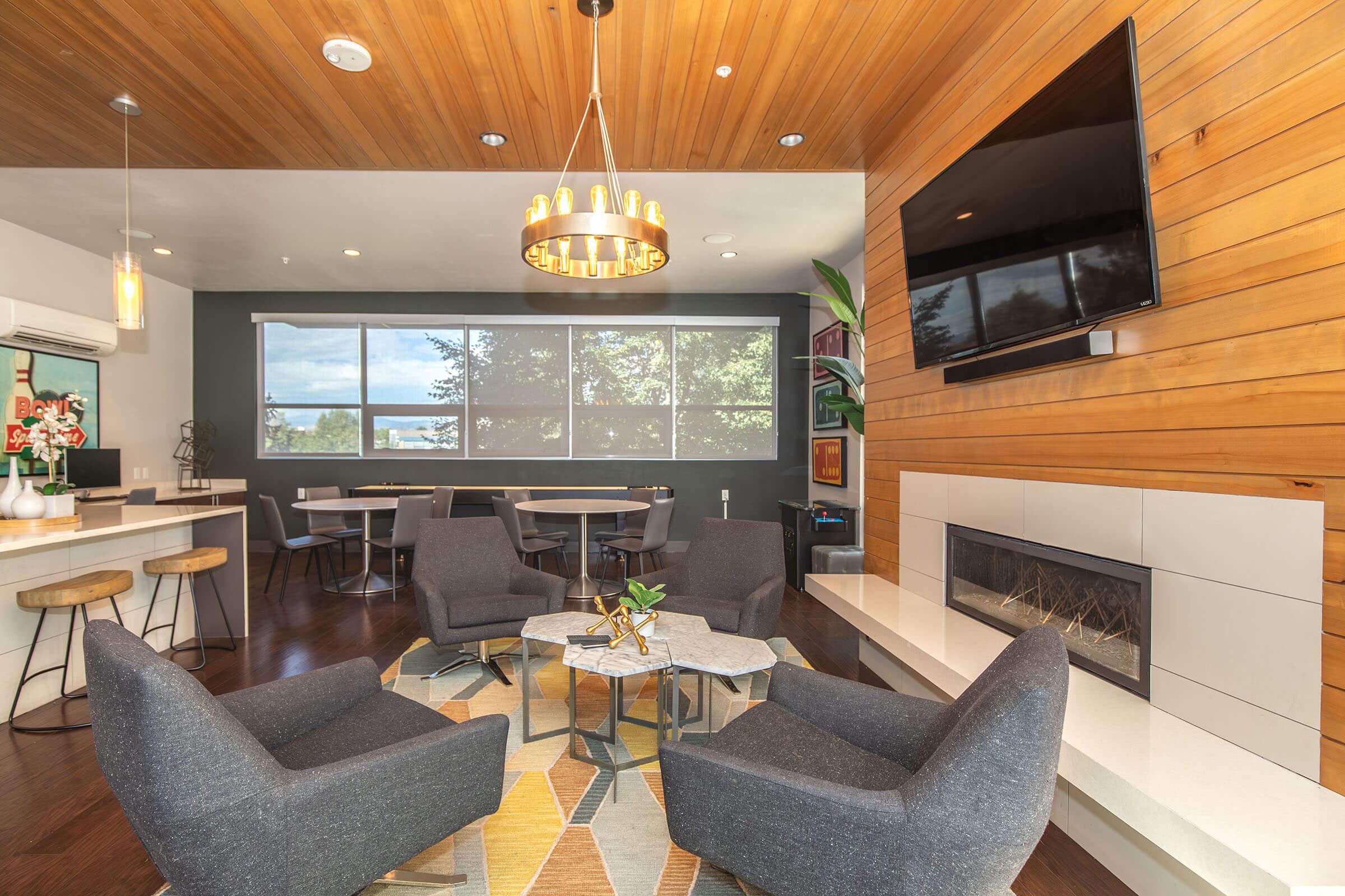 a living room filled with furniture and a flat screen tv