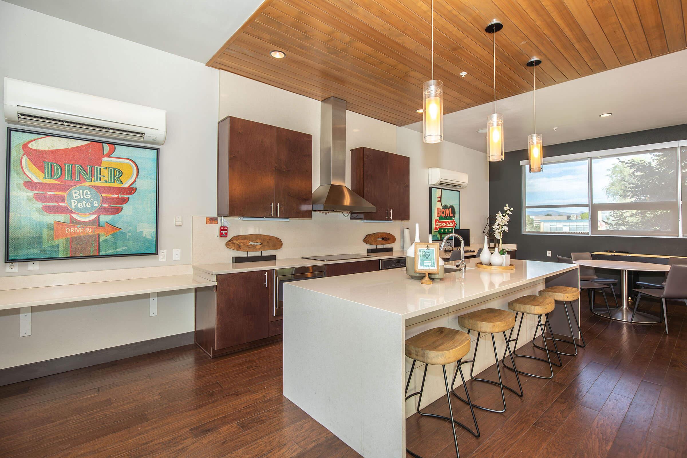 a kitchen with an island in the middle of a room