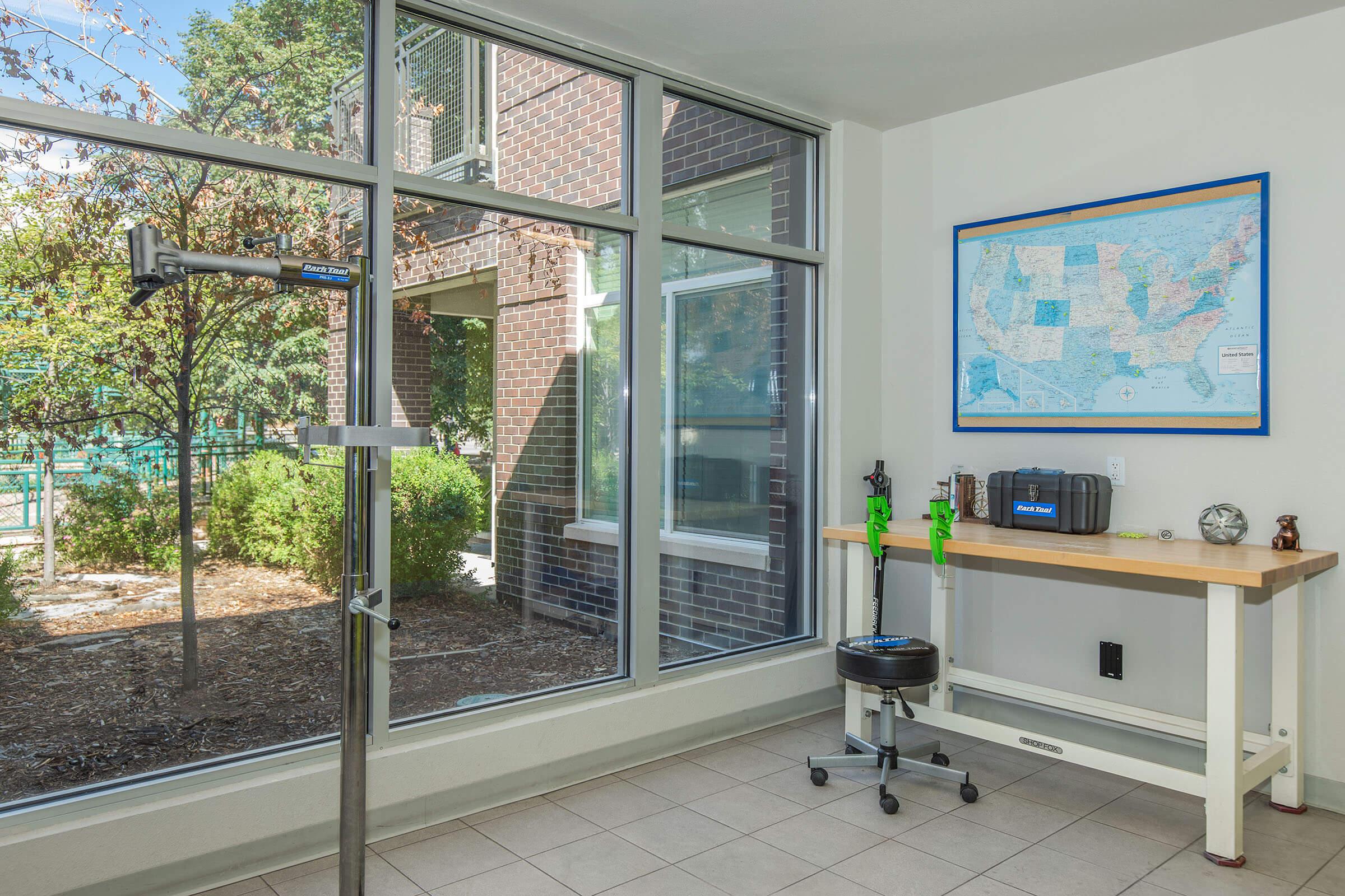 a room filled with furniture and a large window