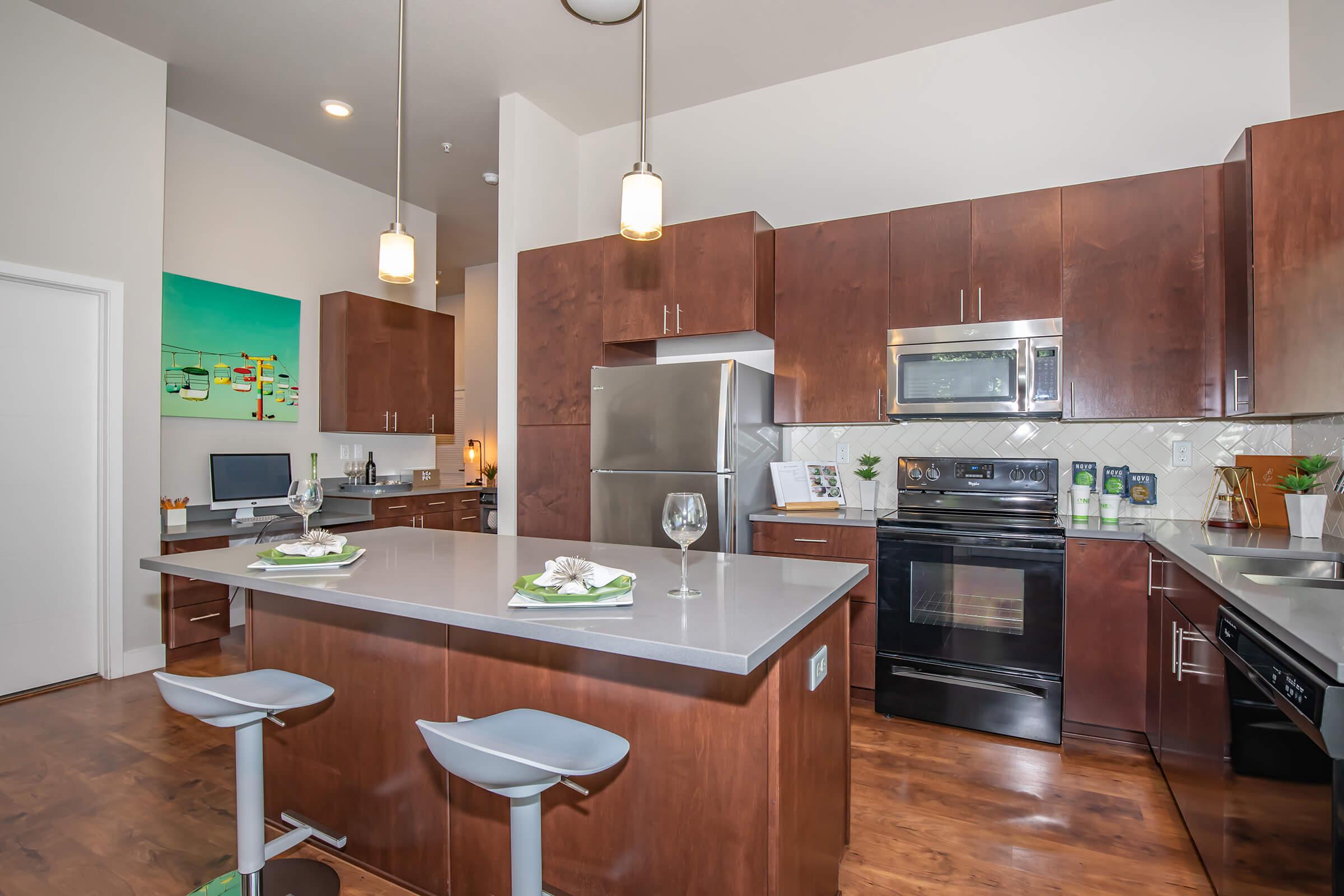 a modern kitchen with stainless steel appliances