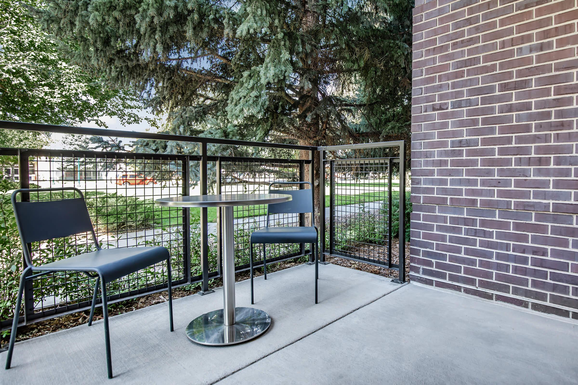 a public bench in front of a brick building