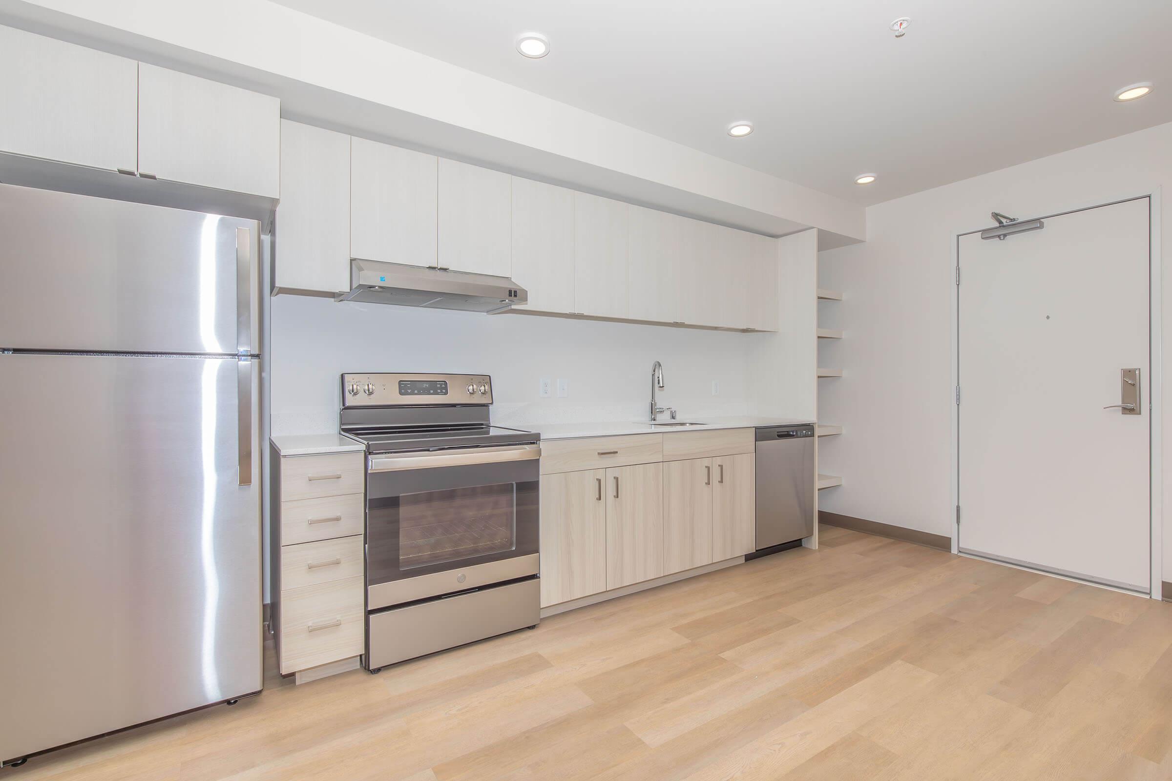 a stainless steel refrigerator in a kitchen