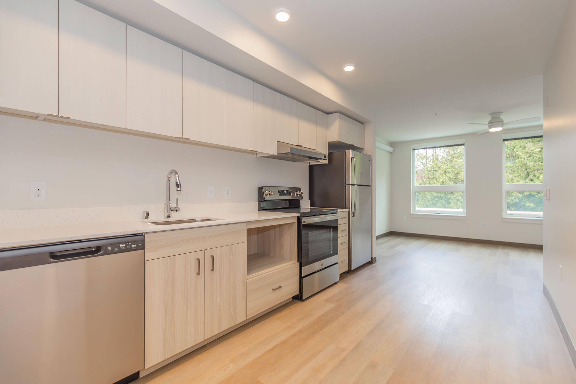 a kitchen with a wood floor