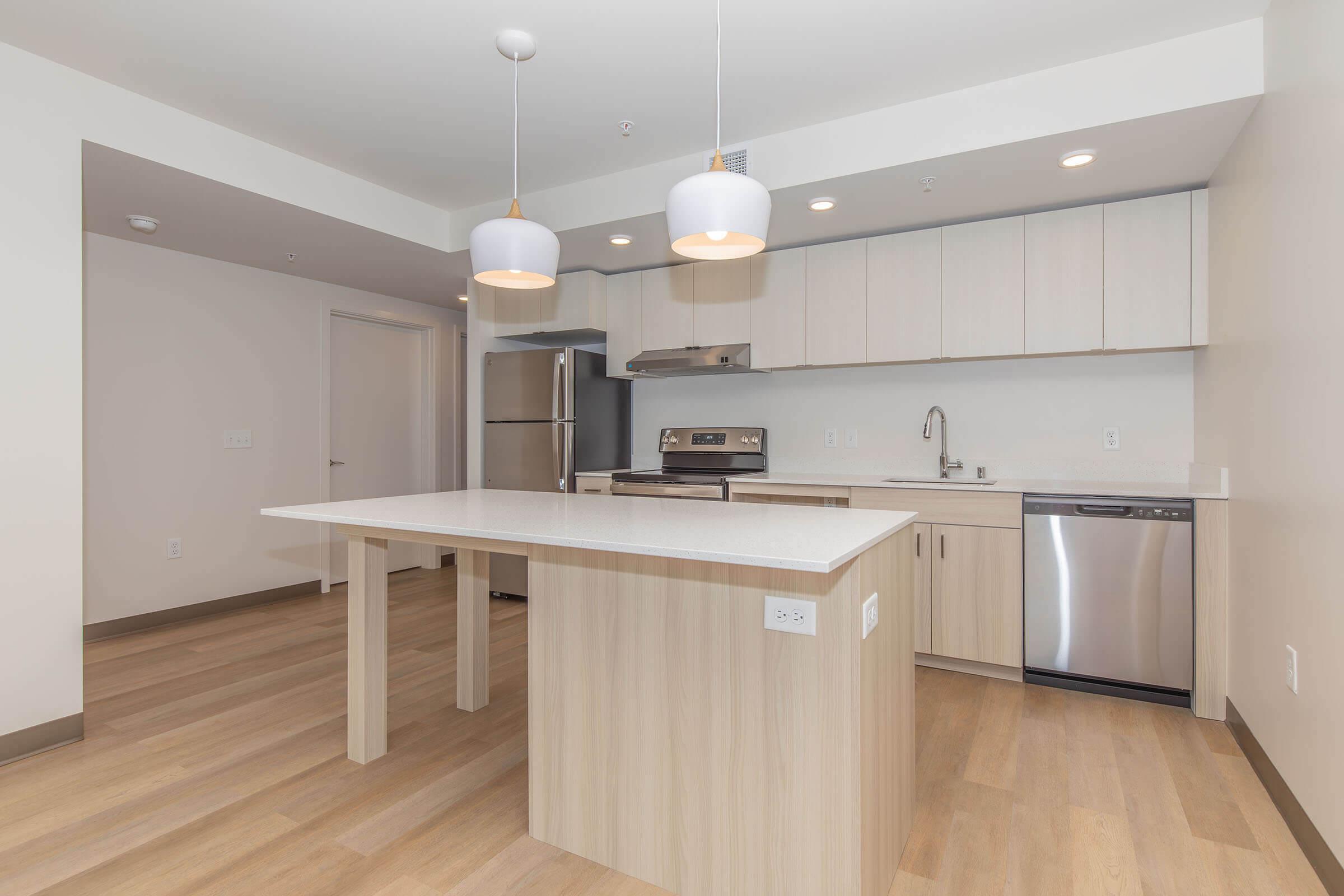 a kitchen with a wood floor