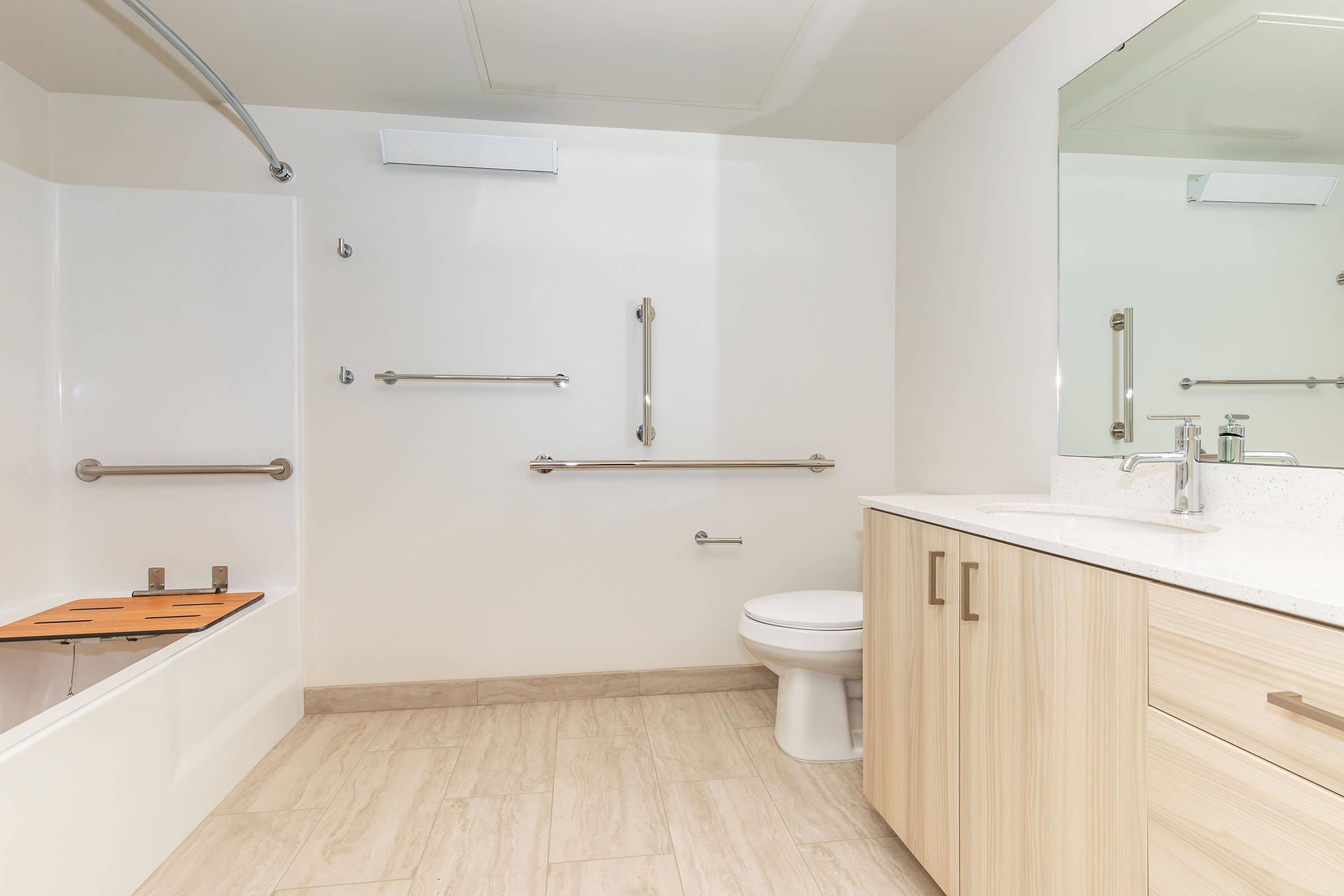 a large tub next to a sink