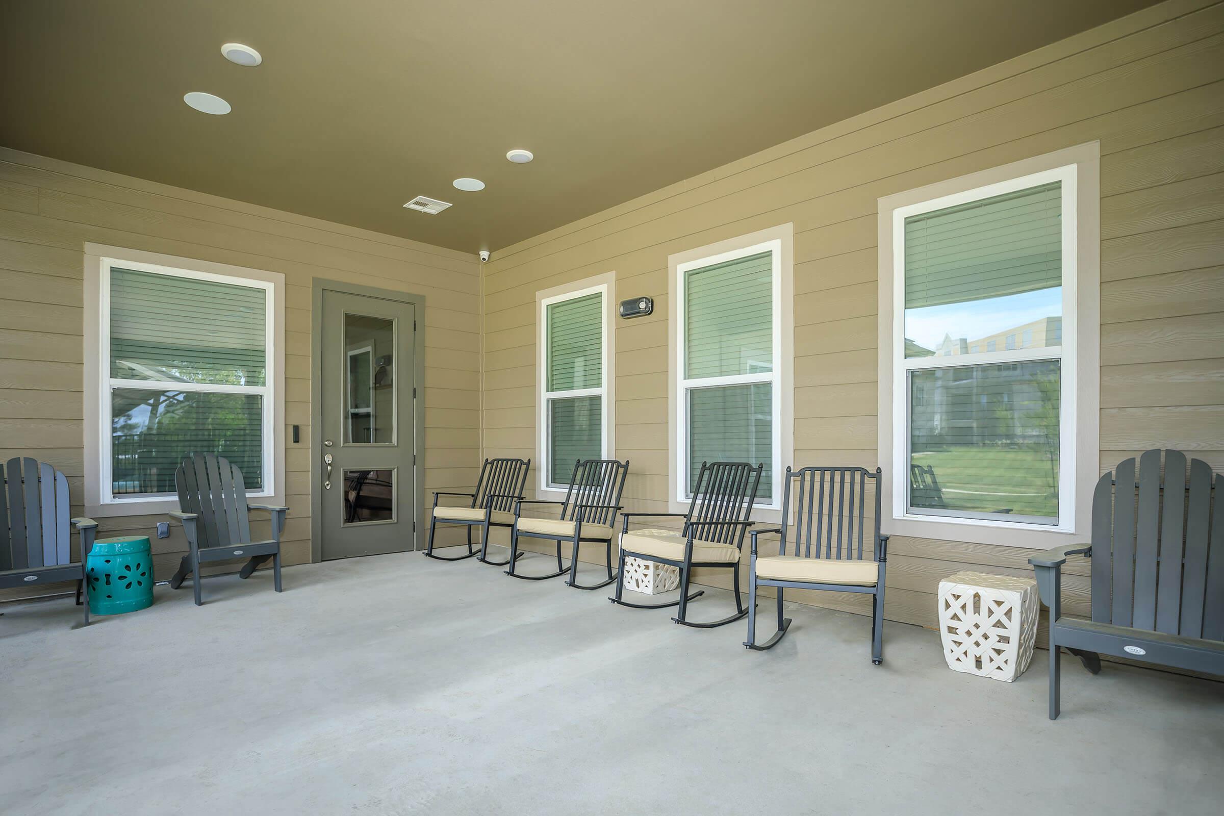 a room filled with furniture and wooden bench in front of a window