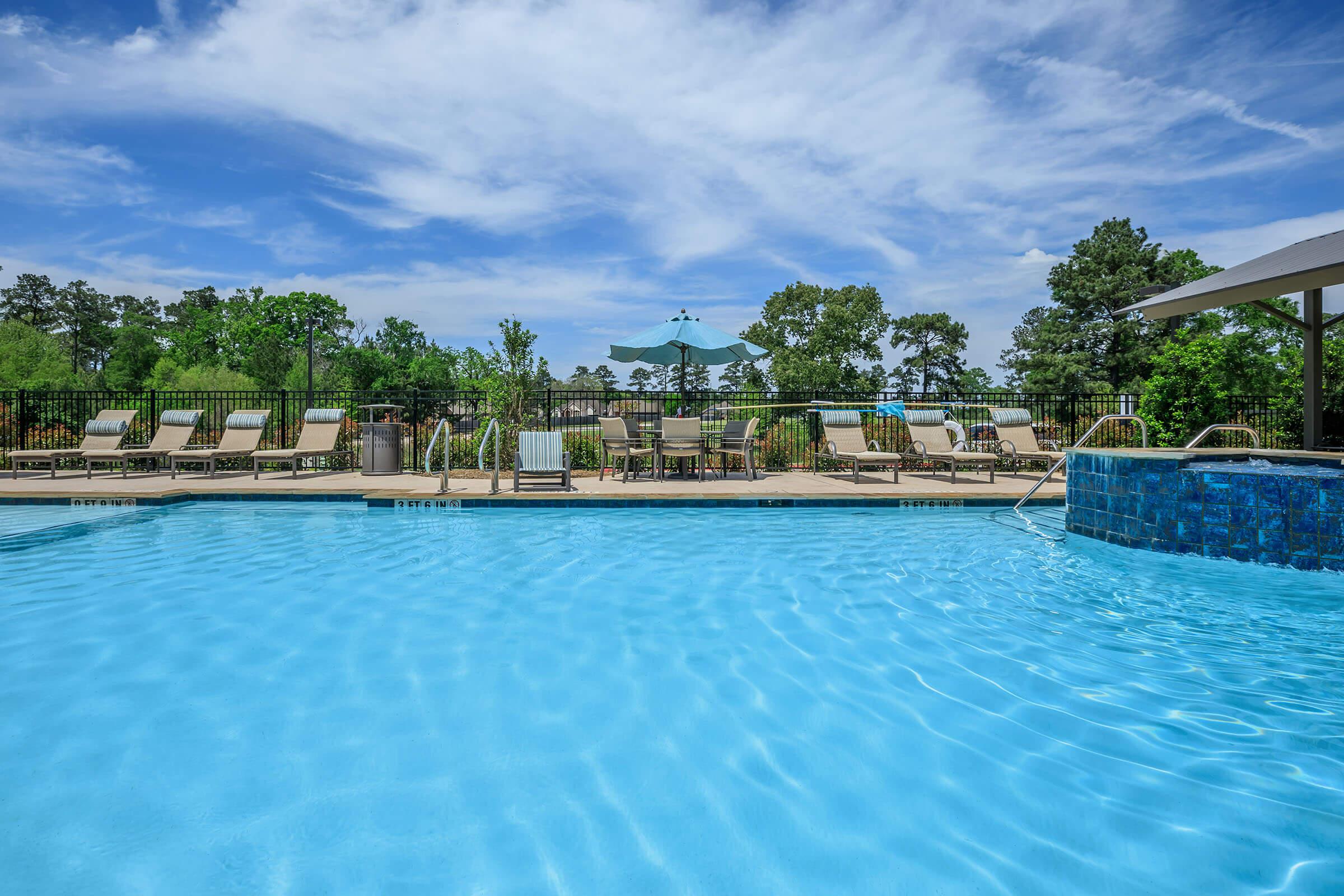 a pool next to a body of water