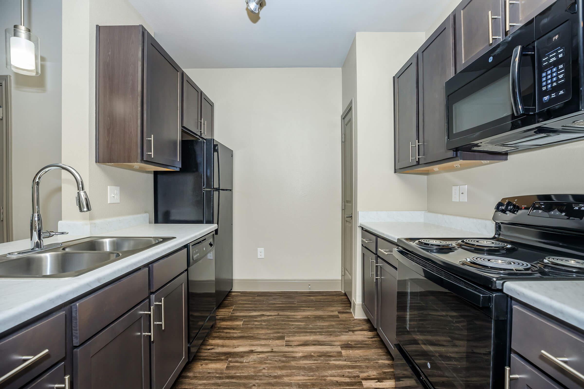 a large kitchen with stainless steel appliances