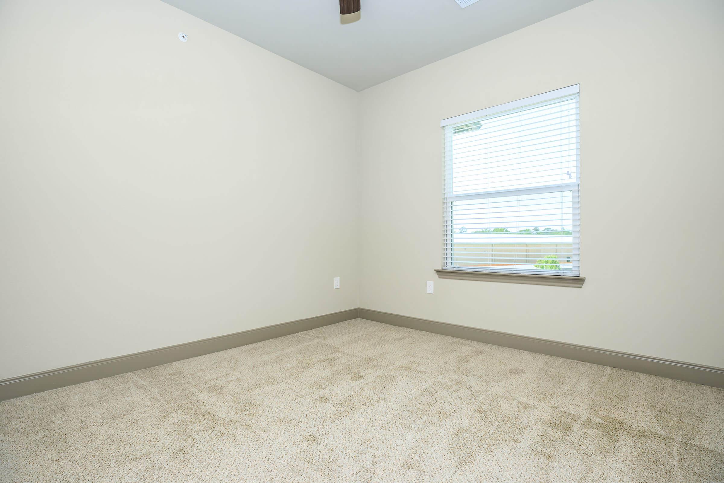 a bedroom with a large window