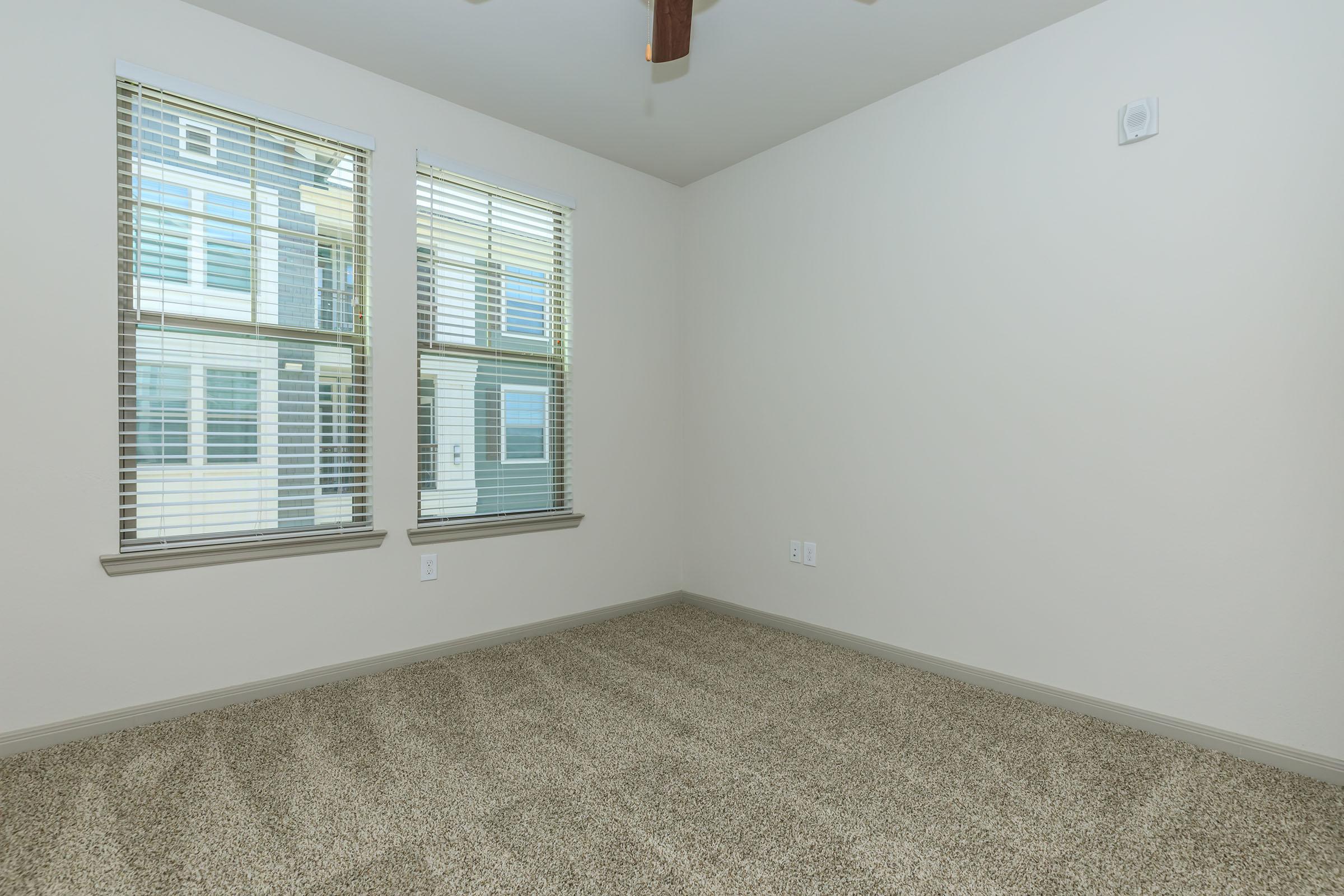 a bedroom with a large window