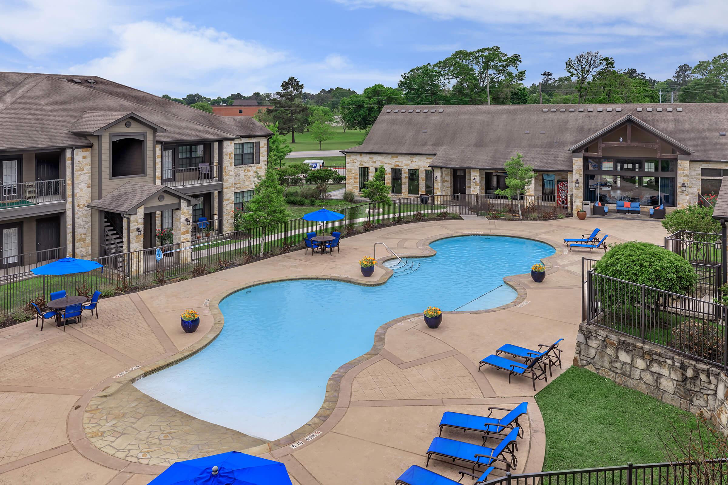 RESORT-STYLE POOL WITH A LARGE SUNDECK